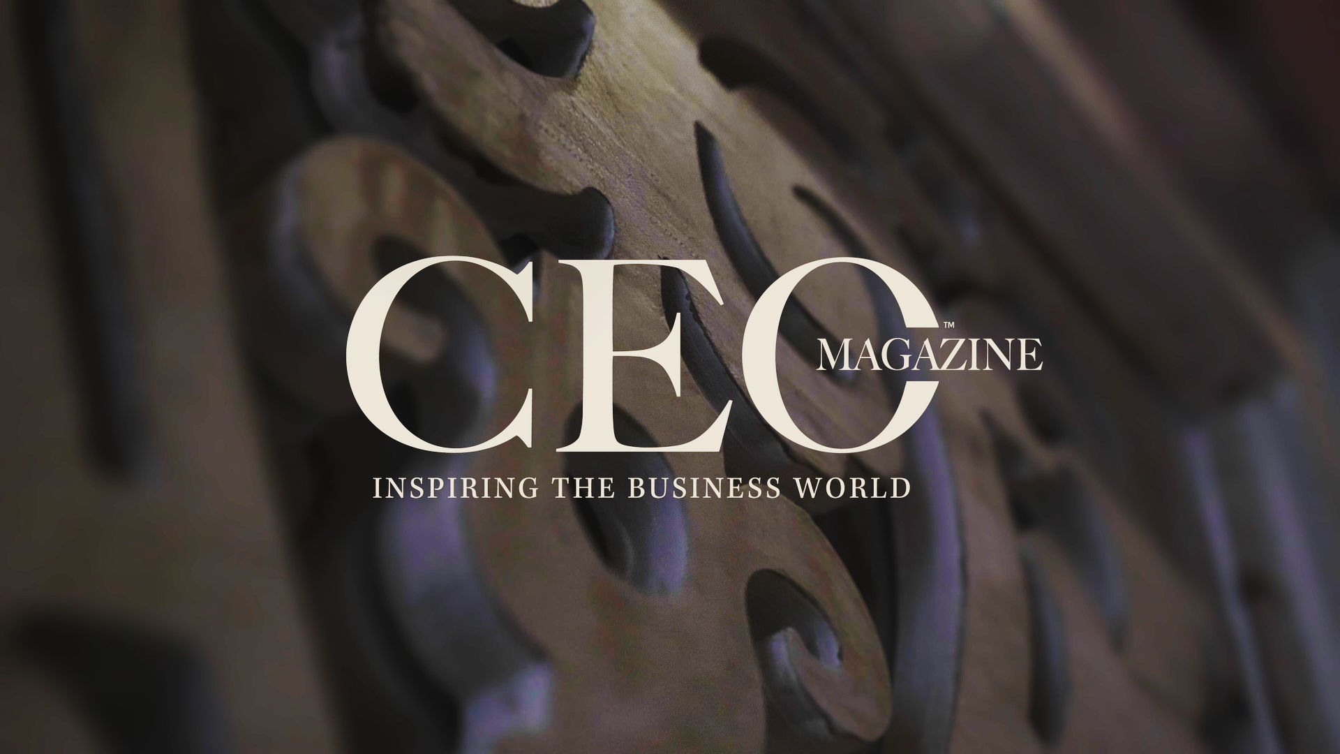 Close-up of decorative wrought iron design with the text 'CEC Magazine Inspiring the Business World' overlayed.