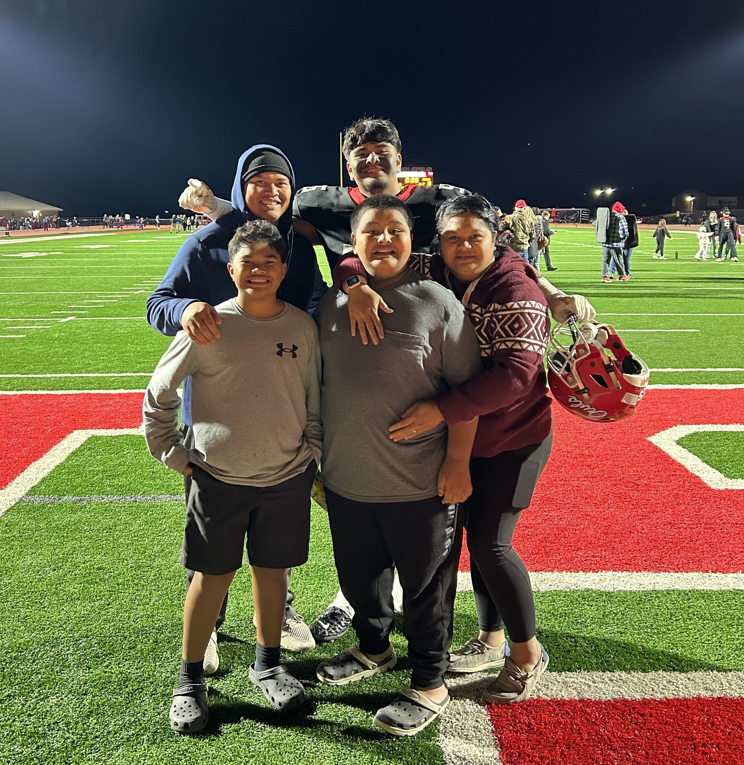 The Ogumoro family celebrate Antoni's win with the Elgin Owls Varsity Football Team that went undefeated winning states during the 2024 4A Oklahoma State Championships