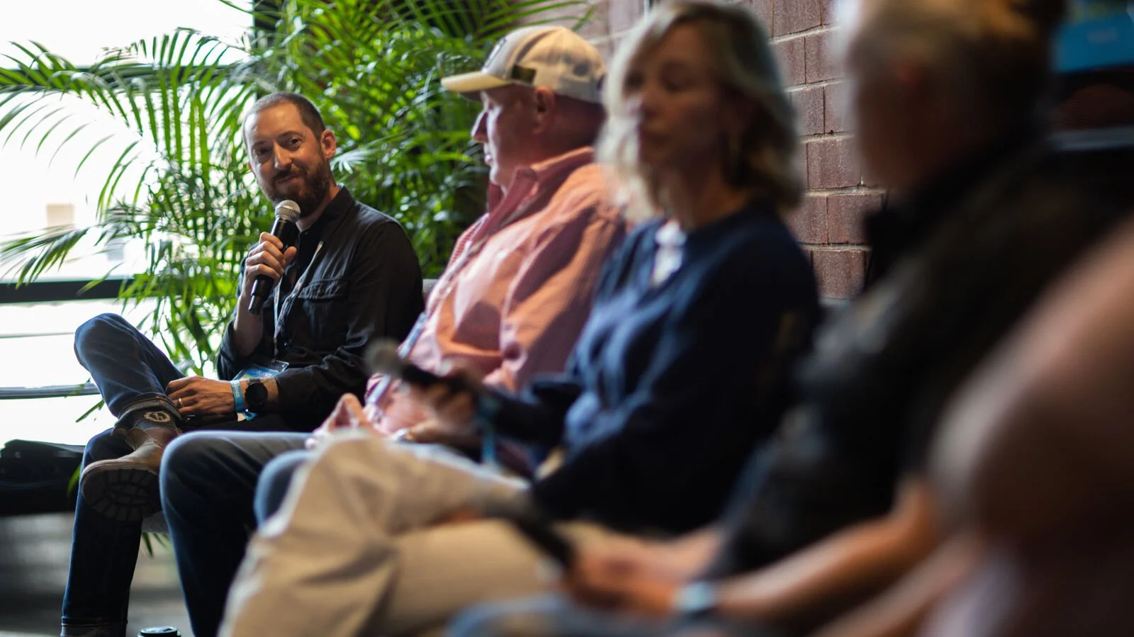 Taylor Winchester leading a panel discussion about live music, talent bookings at festivals, and ticket sales strategies.