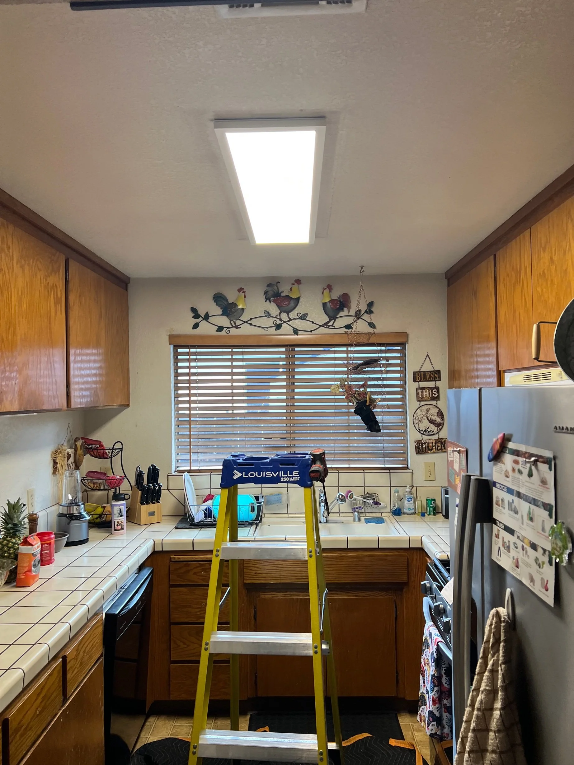 Kitchen lighting converted from fluorescent to LED panels in Stockton by MH Electrical Services.