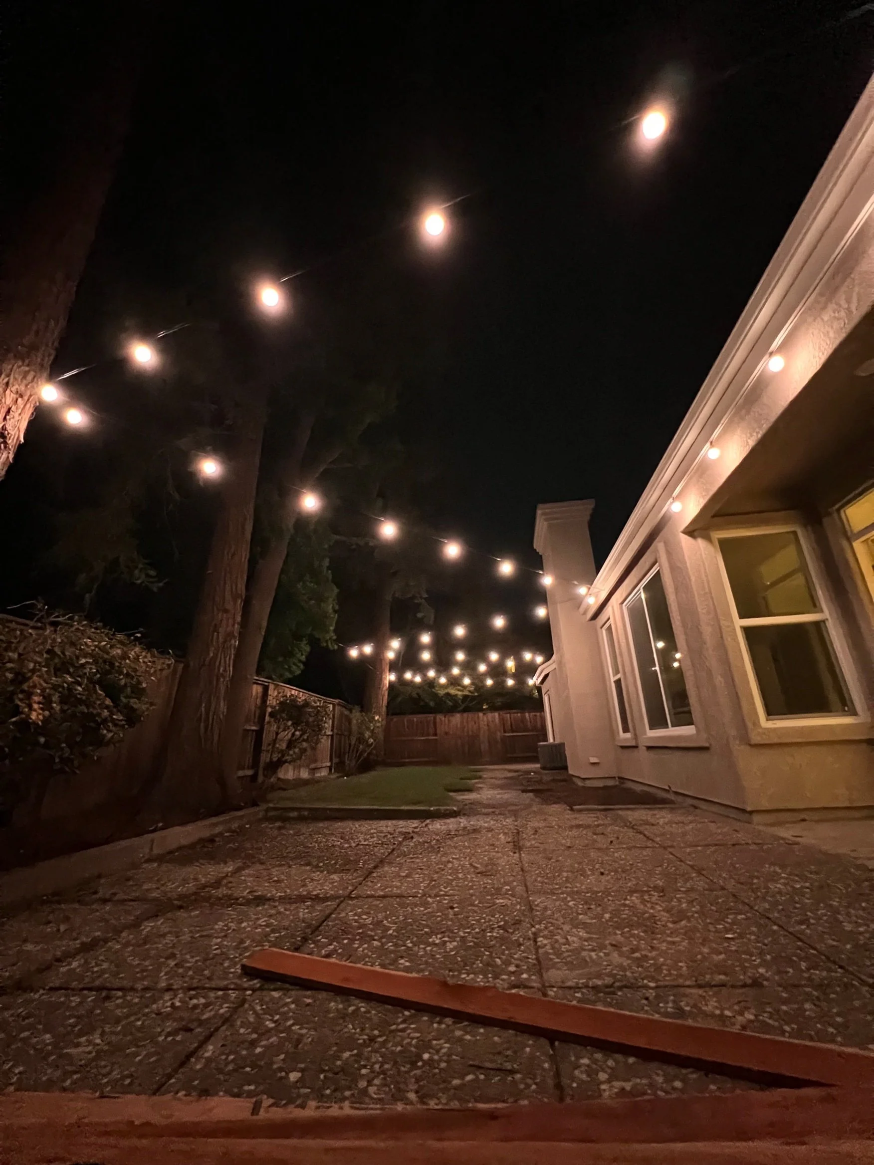 Warm outdoor string lights installed in Stockton by MH Electrical Services.