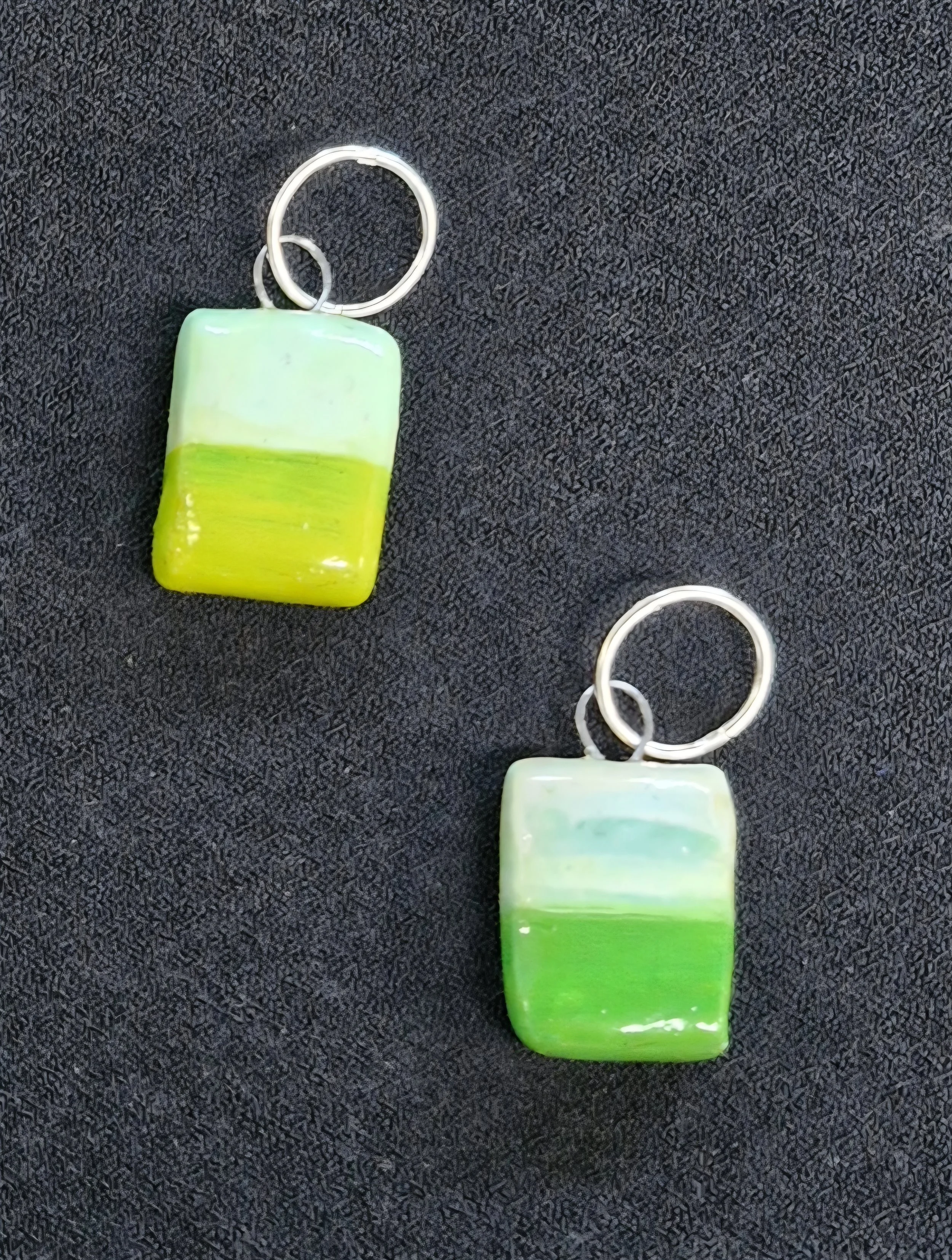 'Green Field' earrings : Porcelain, oil paint, enamel, tungsten wire, sterling silver sleepers. Currently showing at The Collaboration, New Plymouth, Taranaki NZ