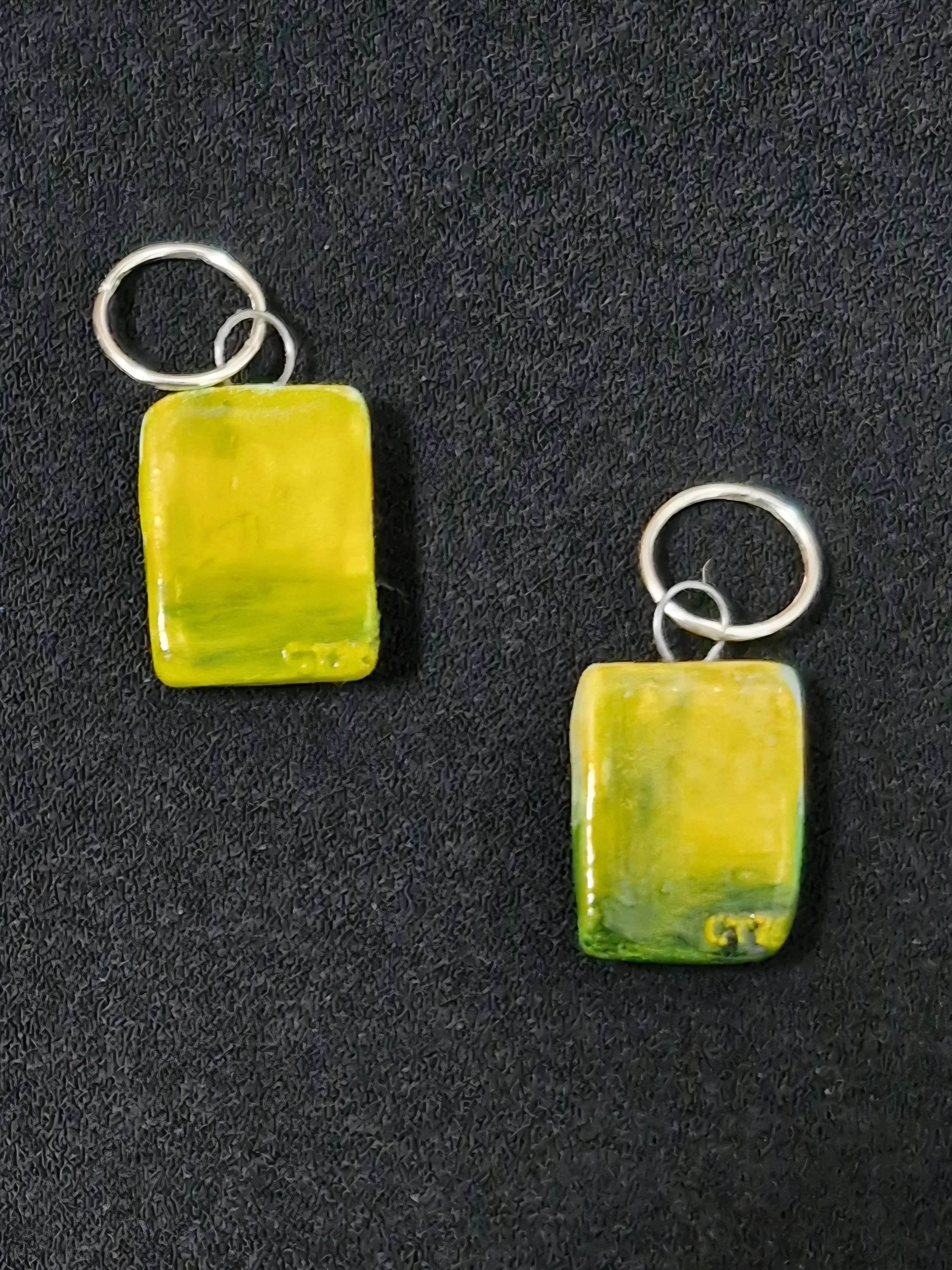 'Green Field' earrings (back) : Porcelain, oil paint, enamel, tungsten wire, sterling silver sleepers. Currently showing at The Collaboration, New Plymouth, Taranaki NZ
