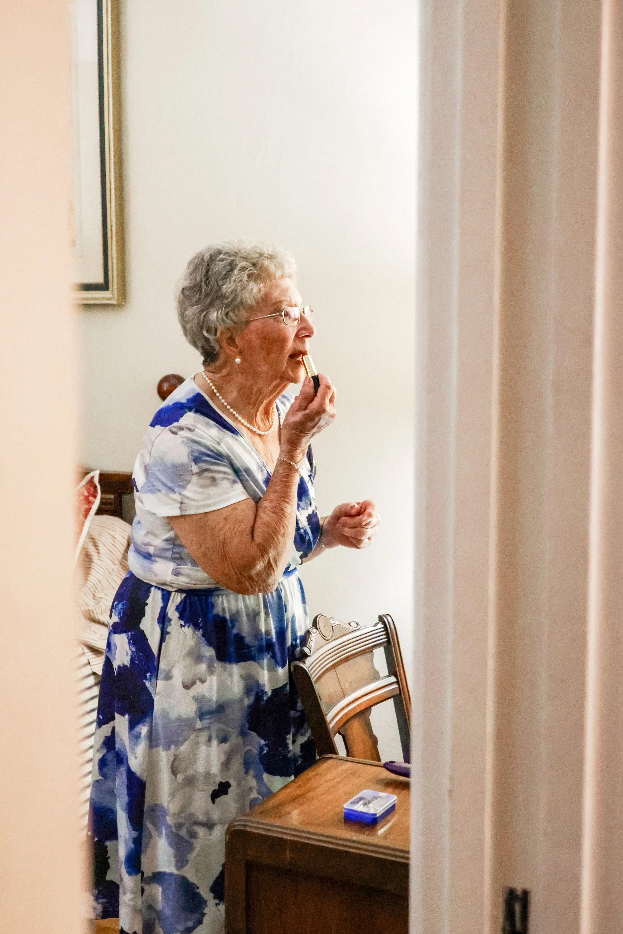 Wedding guest getting ready — NYLEAR documentary wedding photography capturing candid behind-the-scenes moments in the Pacific Northwest