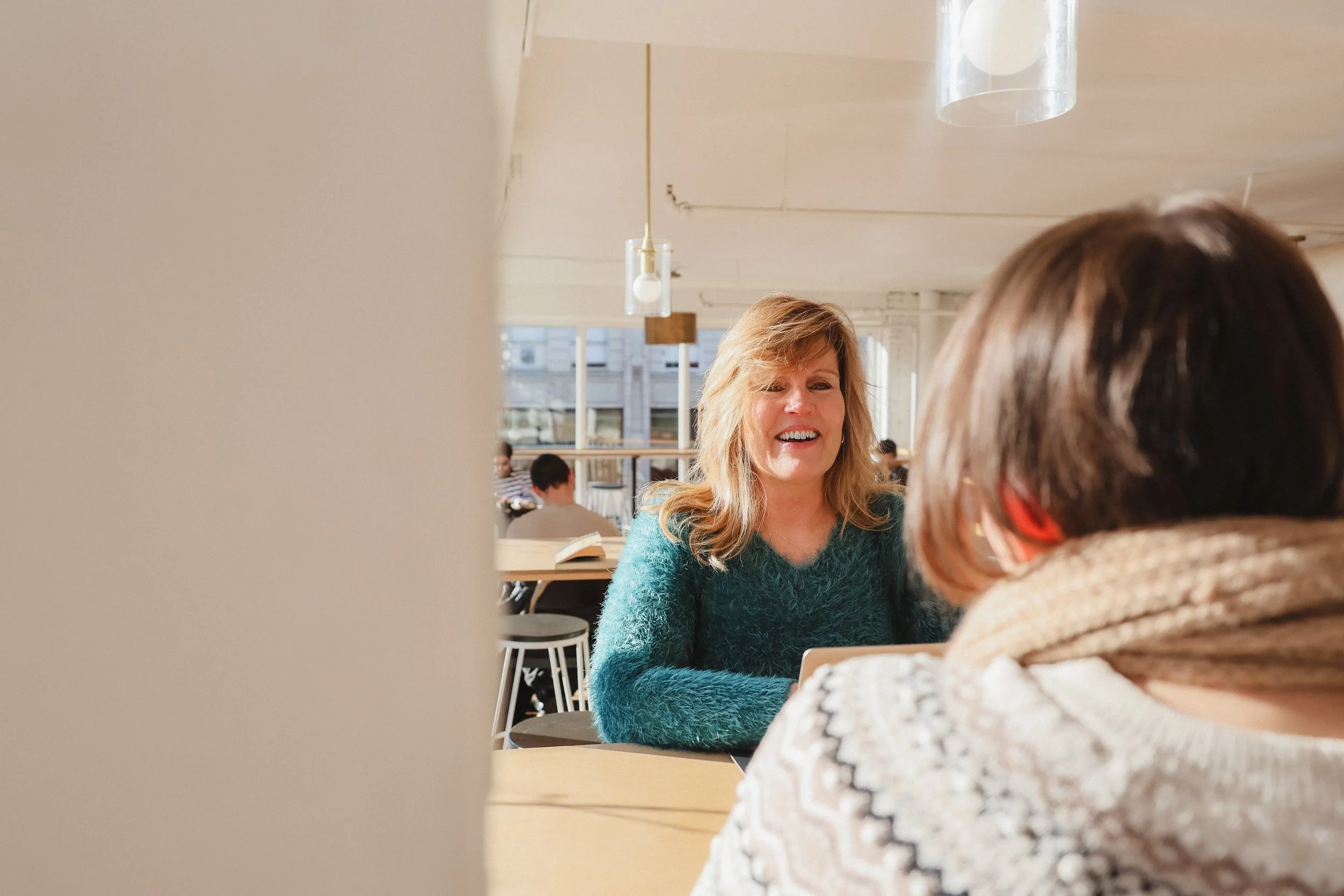 Barbara Jenks of Clearly Communicate meeting a client — personal branding photography by NYLEAR Bellingham WA