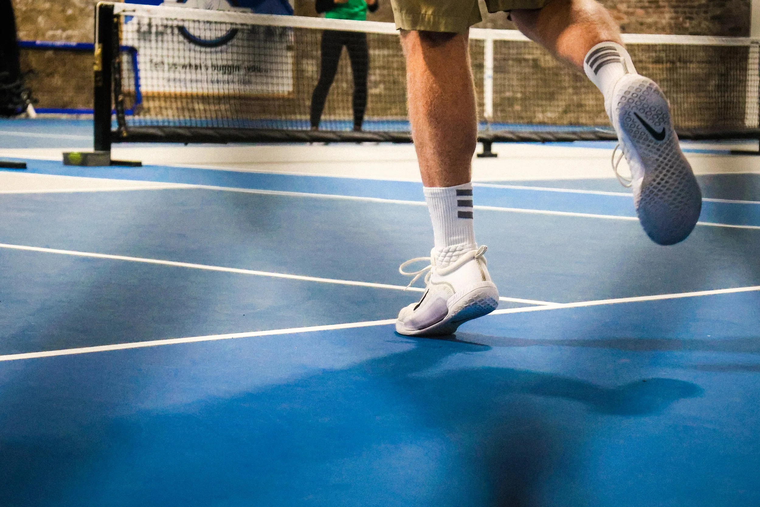 Pickleball court action detail — NYLEAR local fitness business social media marketing for Pacific Northwest sports and recreation clients