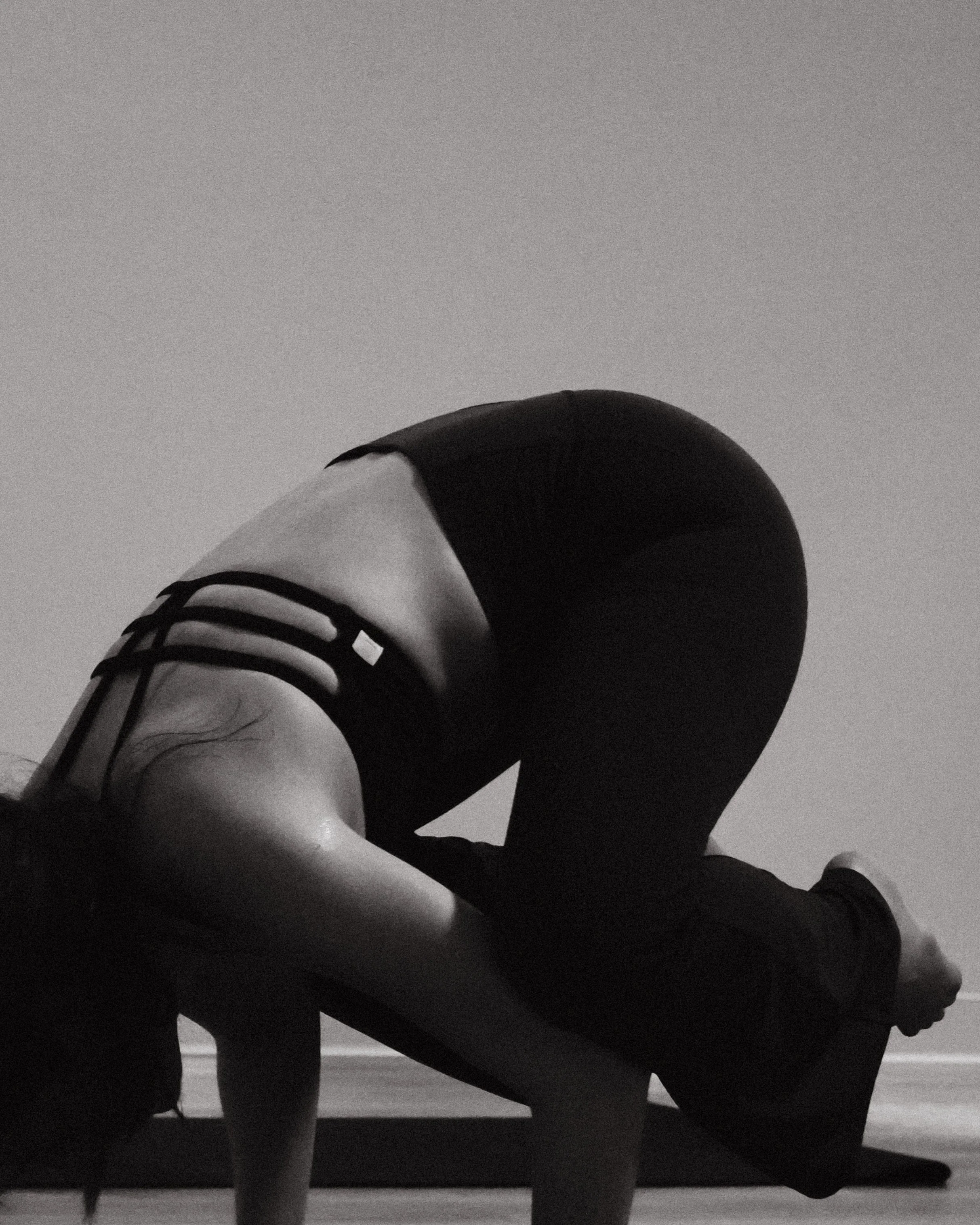 Yoga student in downward dog pose — NYLEAR fitness studio social media content marketing strategy Bellingham WA