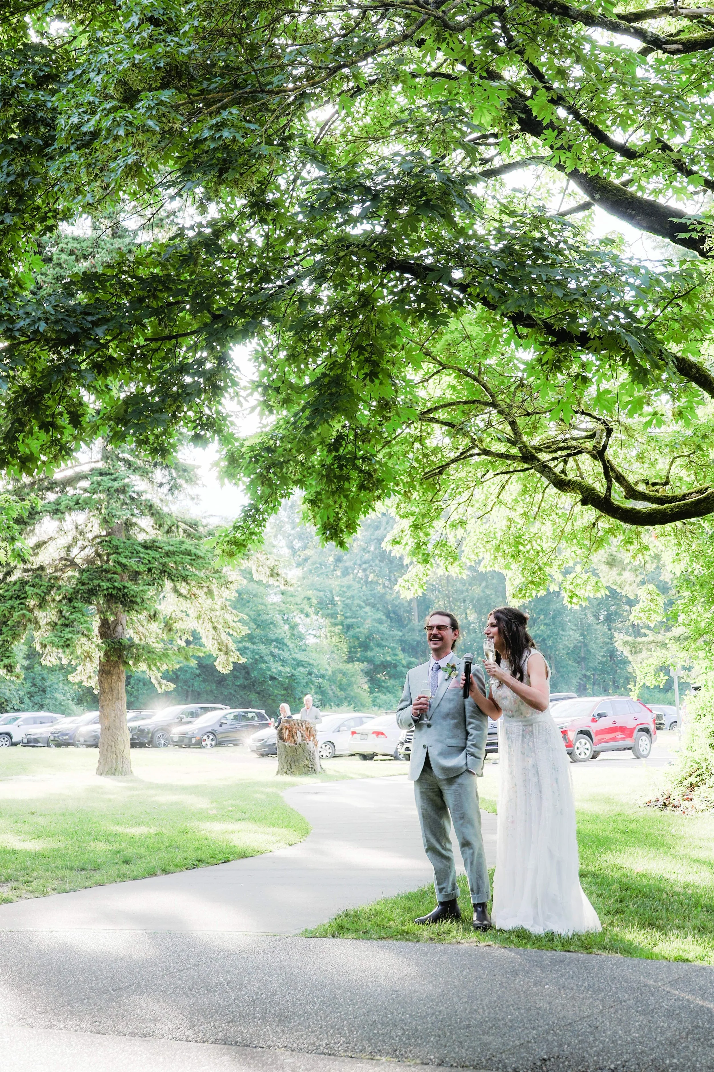 Pacific Northwest outdoor wedding ceremony under tree — NYLEAR documentary-style wedding photography serving Bellingham WA