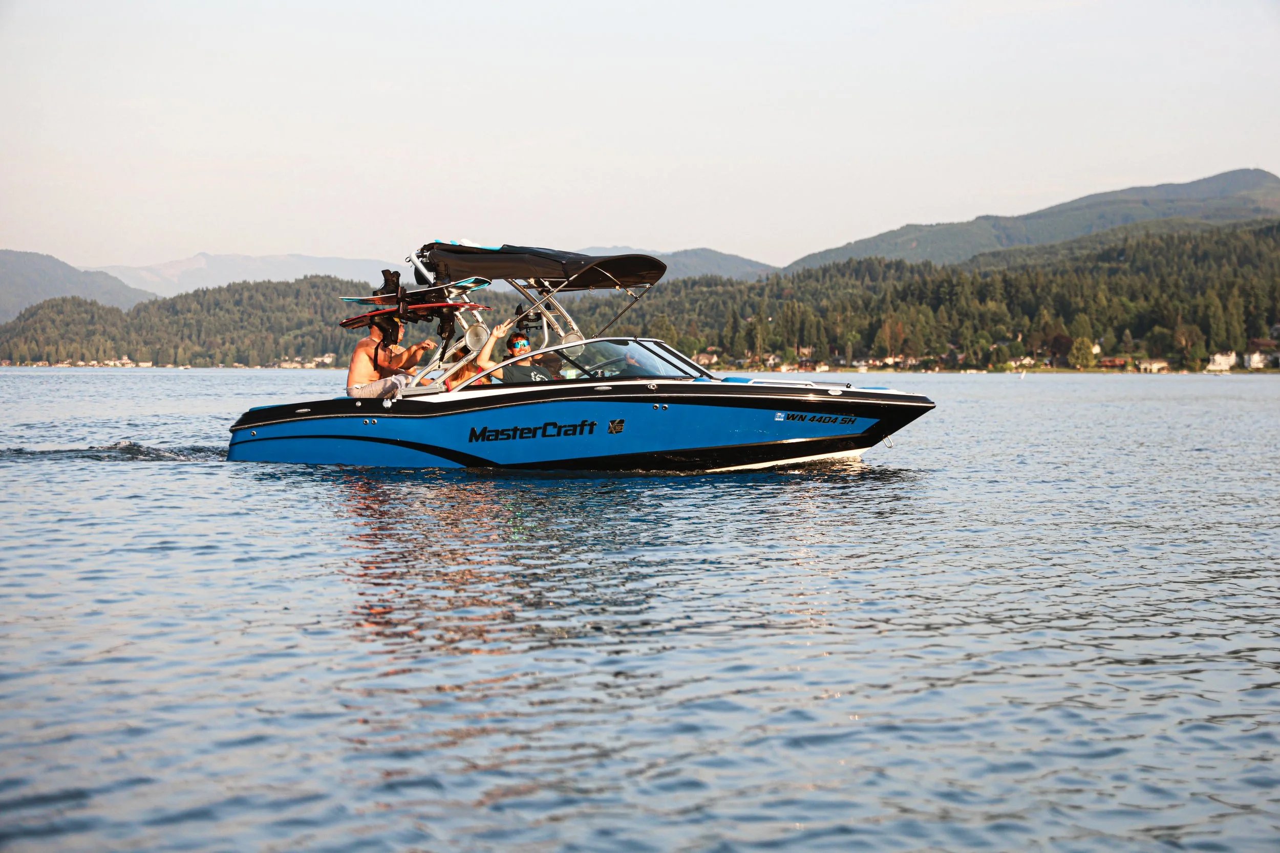 Whatcom Wake Sports MasterCraft boat on a Bellingham WA lake — NYLEAR local recreation business digital marketing client