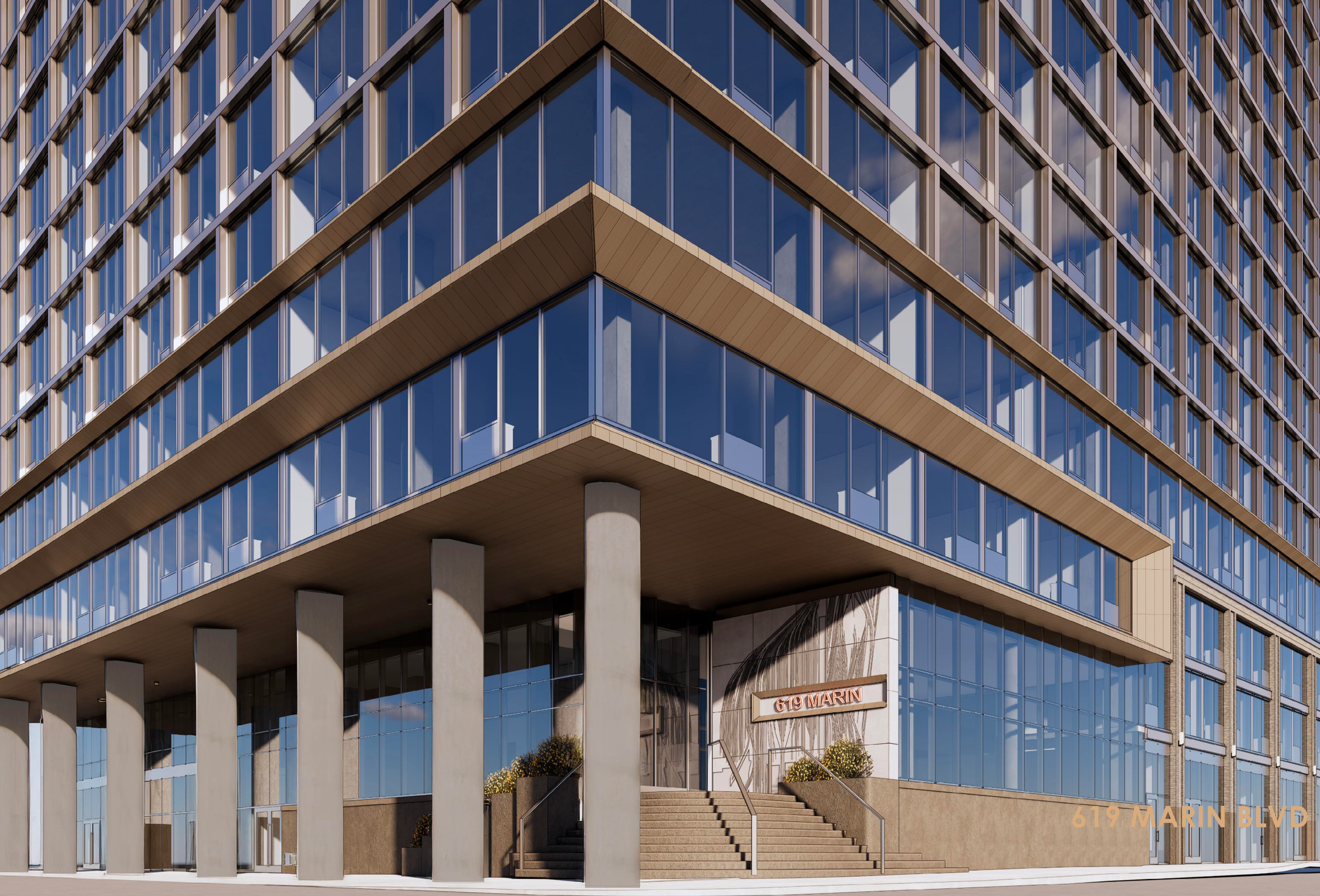 Modern multi-story glass building with balcony and concrete pillars, with stairs leading to the entrance and a sign reading 619 Marin Blvd.