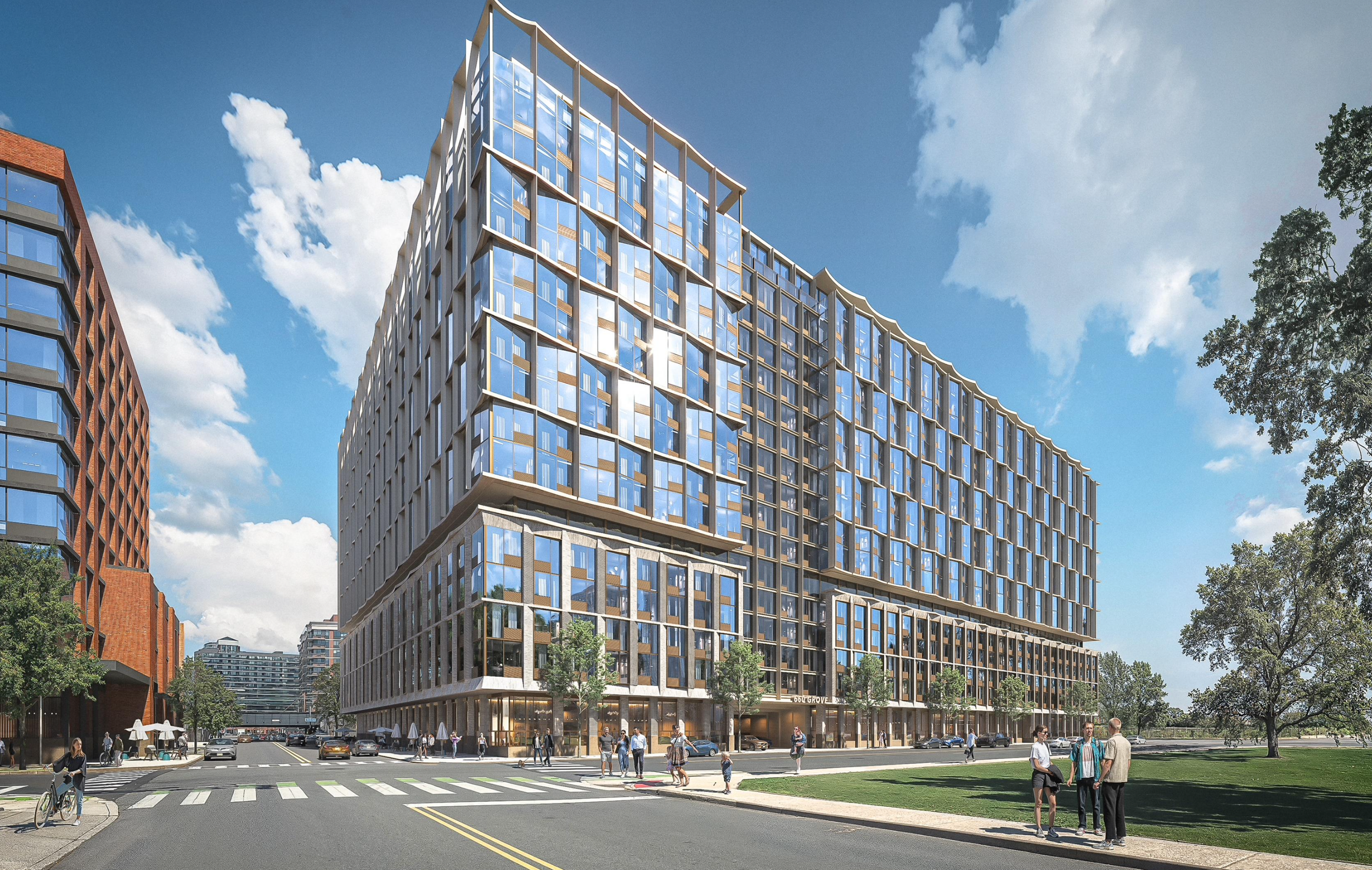 A modern multi-story building with a glass and wood exterior, situated at a busy urban street corner. People are walking and riding bicycles on the sidewalk, and cars are on the road. The sky is blue with scattered clouds, and trees are visible on the right side.