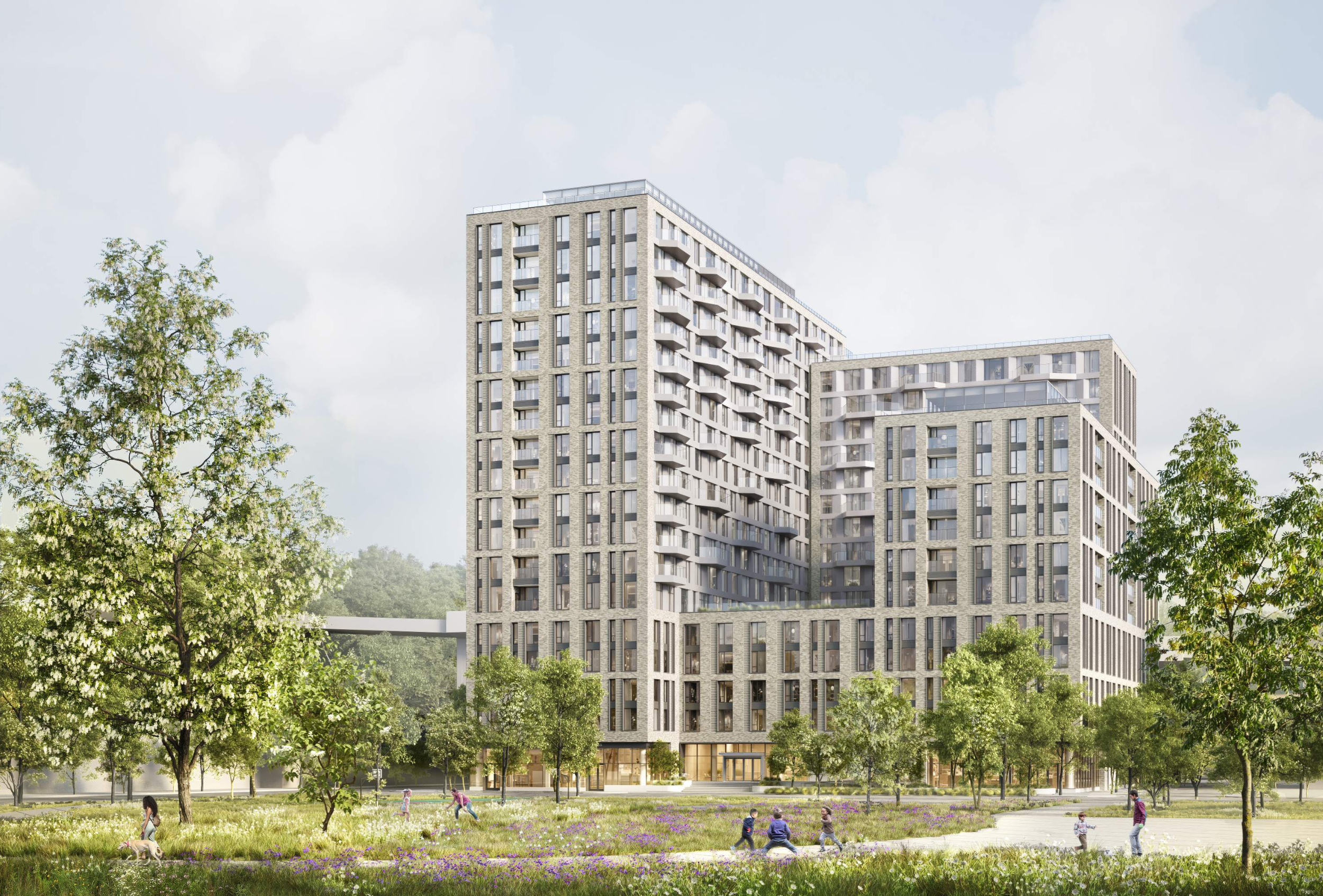 Modern high-rise apartment building with trees and a park in the foreground, children playing on the grass.