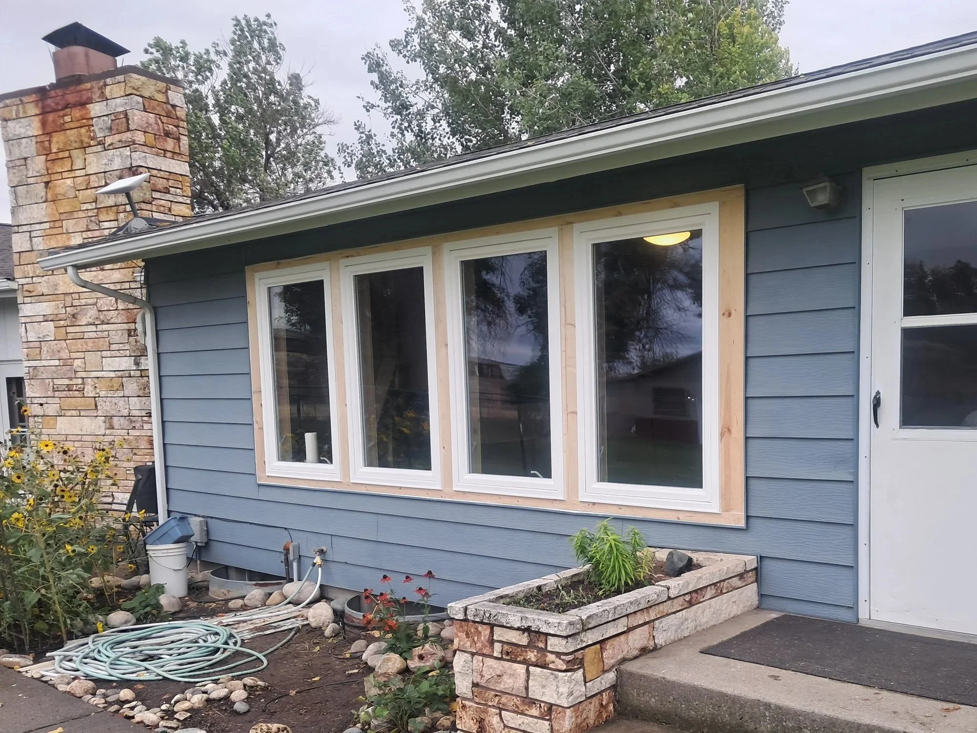 Residential window replacement including interior and exterior trim by Zilkoski Construction LLC.