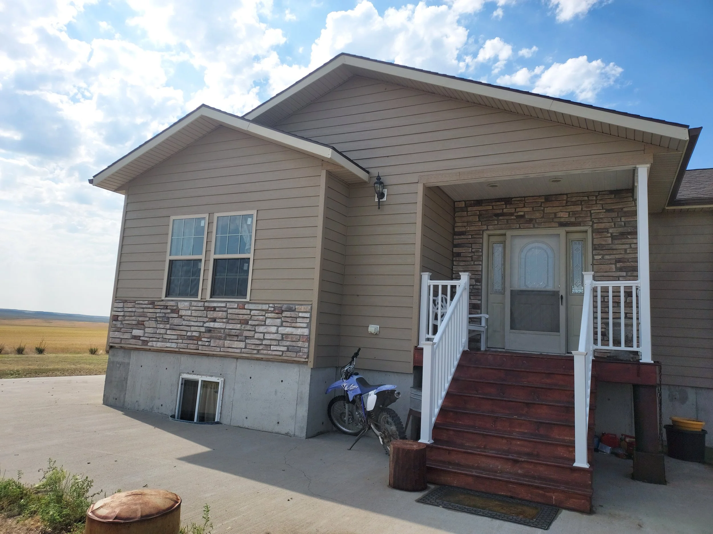 Residential exterior renovation with new siding.