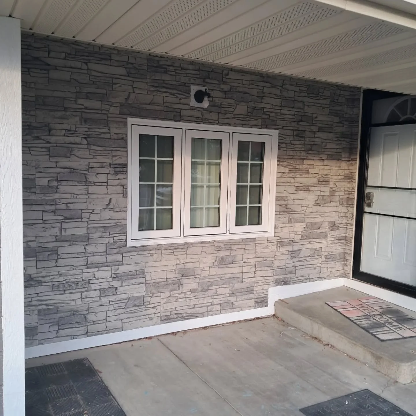 Front porch new stone work siding installation and trim work by Zilkoski Construction LLC.