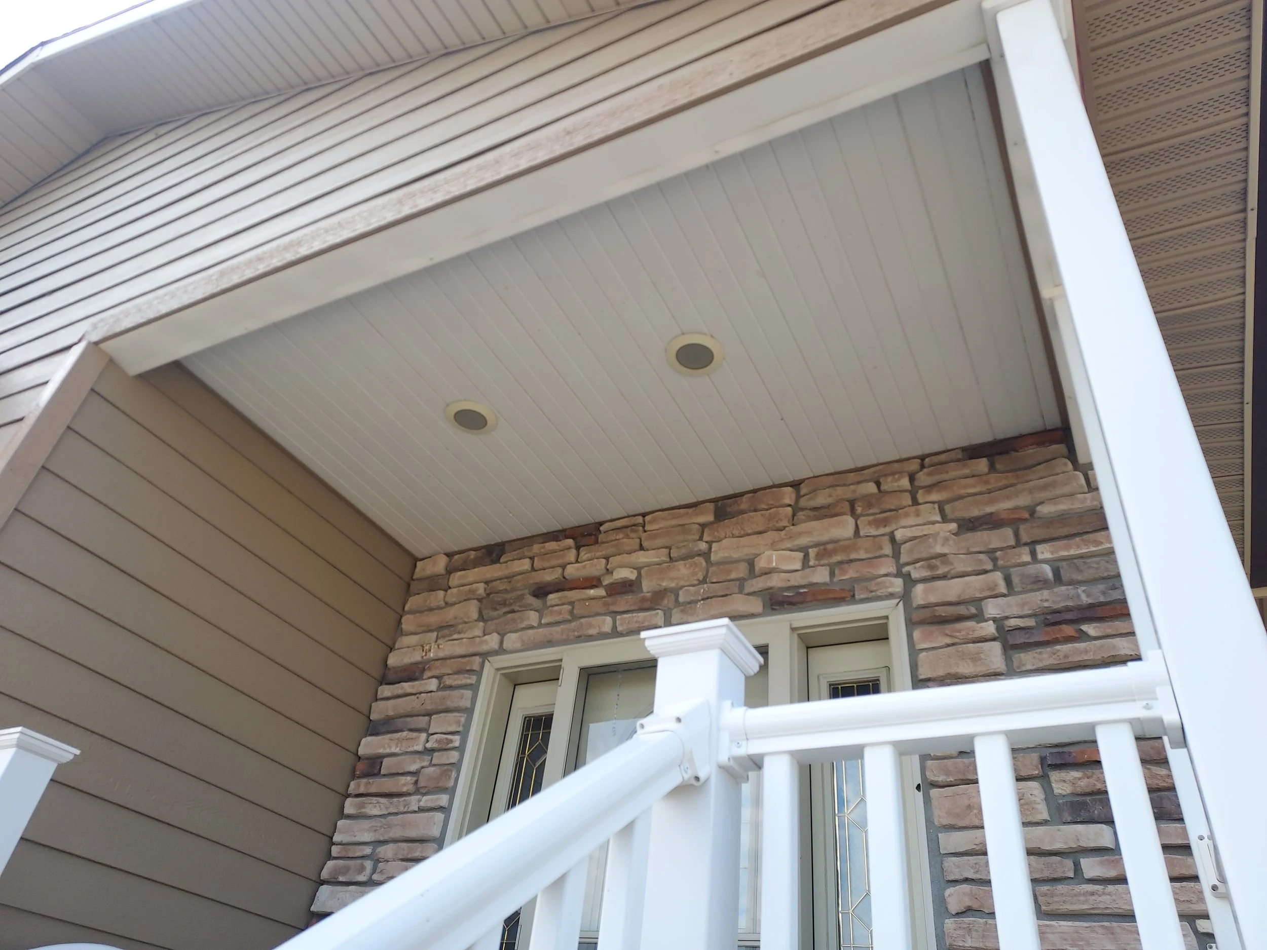 Front porch soffit and recessed lighting installation 
