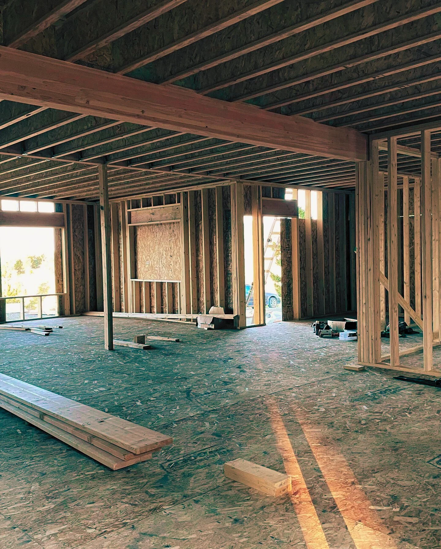 Interior framing and structural layout for residential construction project. 