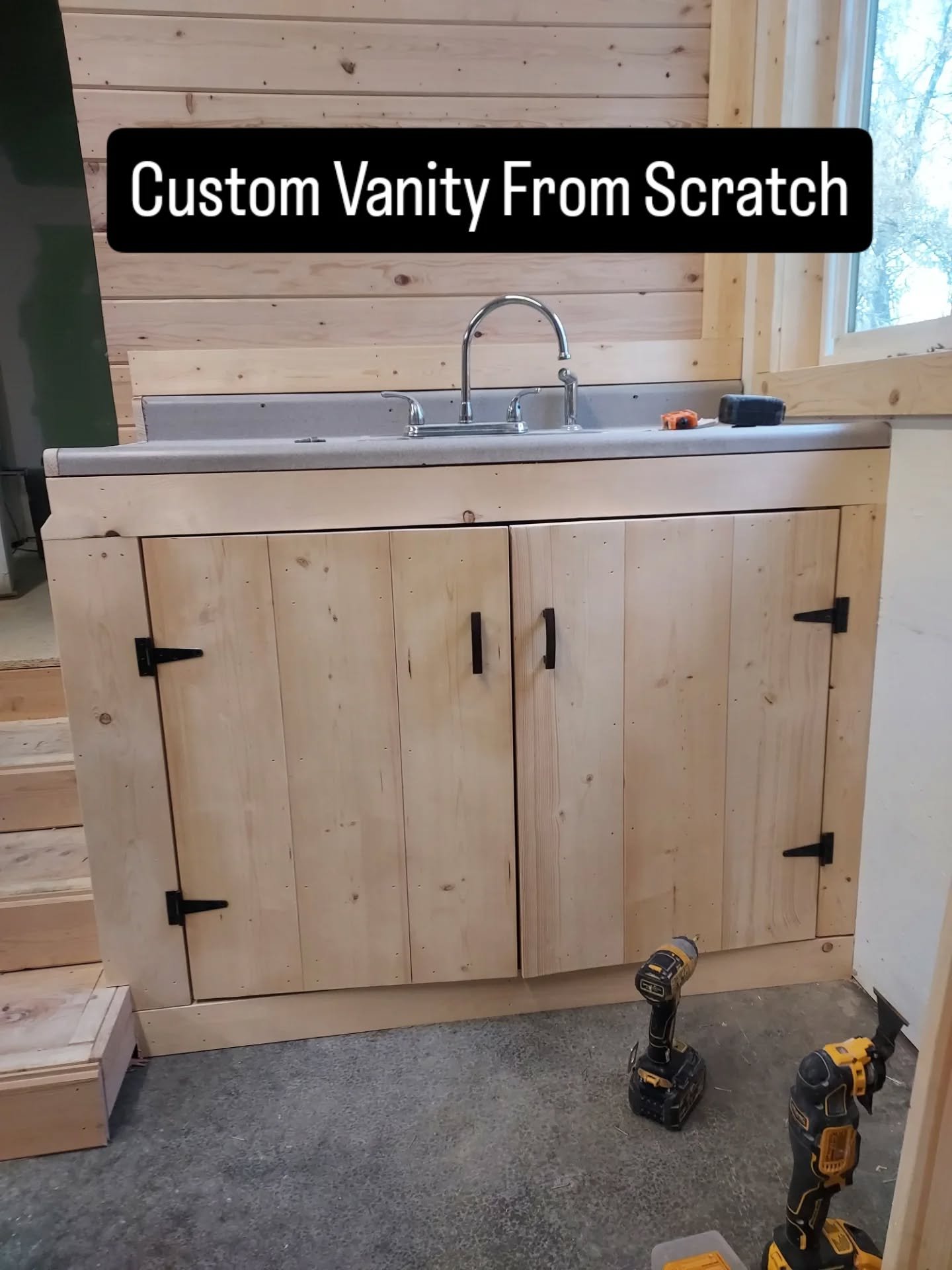 Custom wood vanity cabinet built and installed by Zilkoski Construction LLC. 