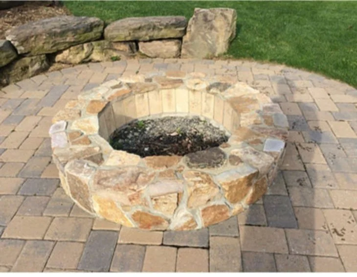 Custom Stone Firepit Built On Hardsaped Stone Patio