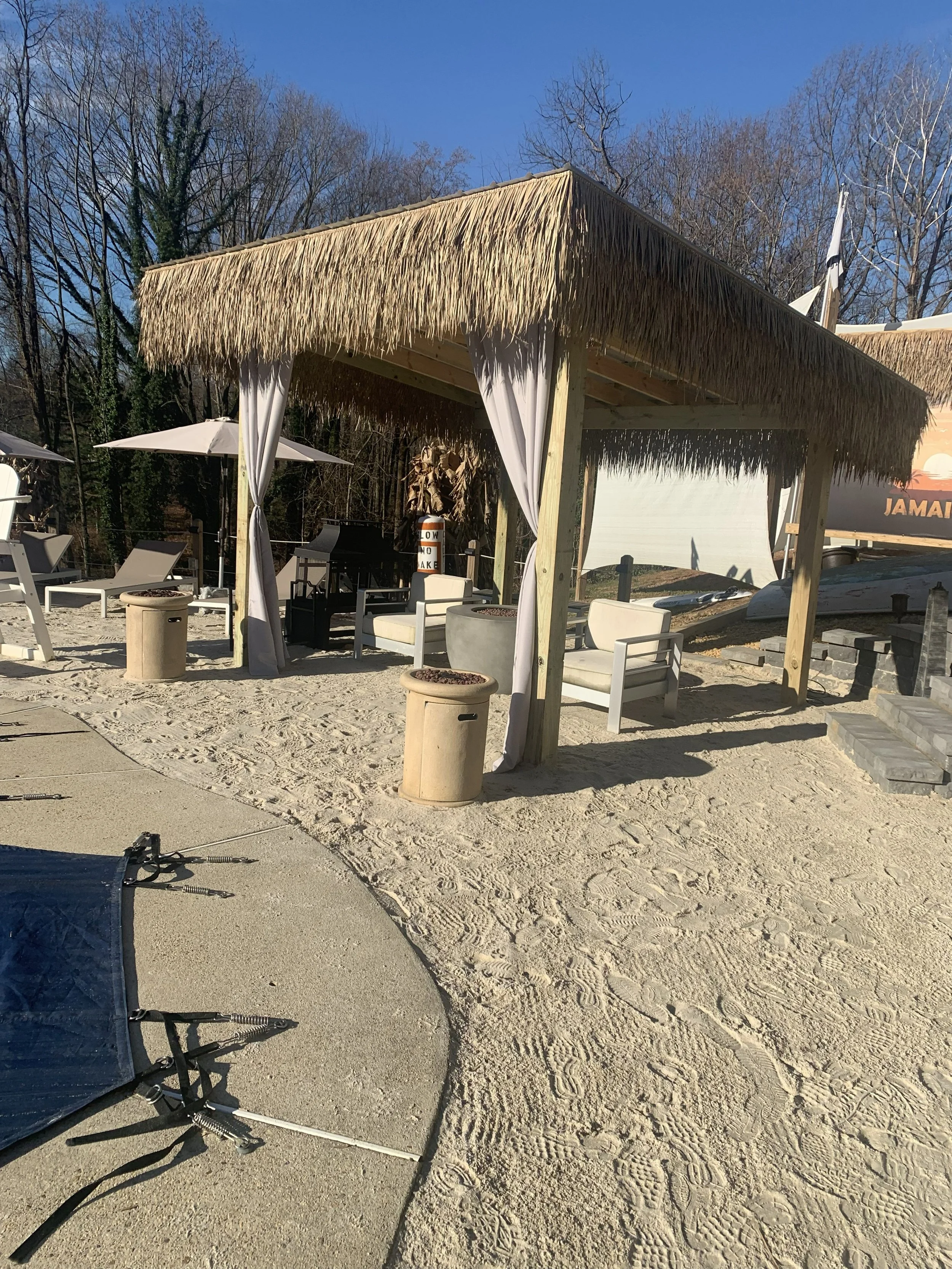 Tiki Hut in Sand at Next to Inground Pool