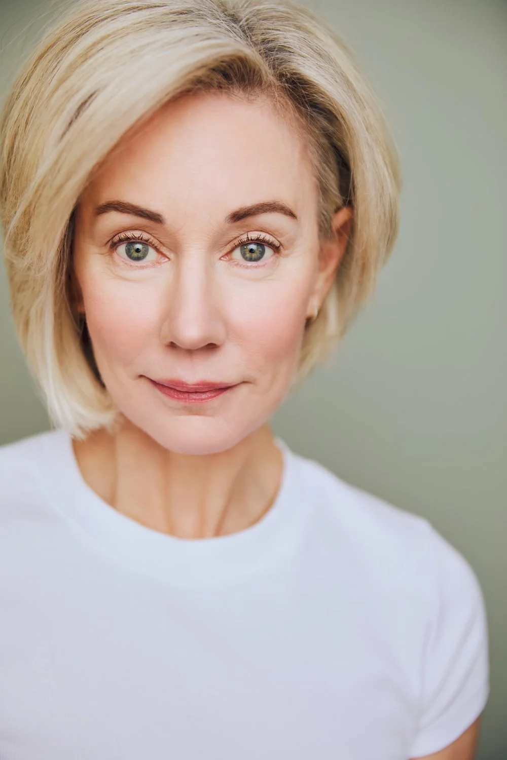 Laura Austin Headshot above About button