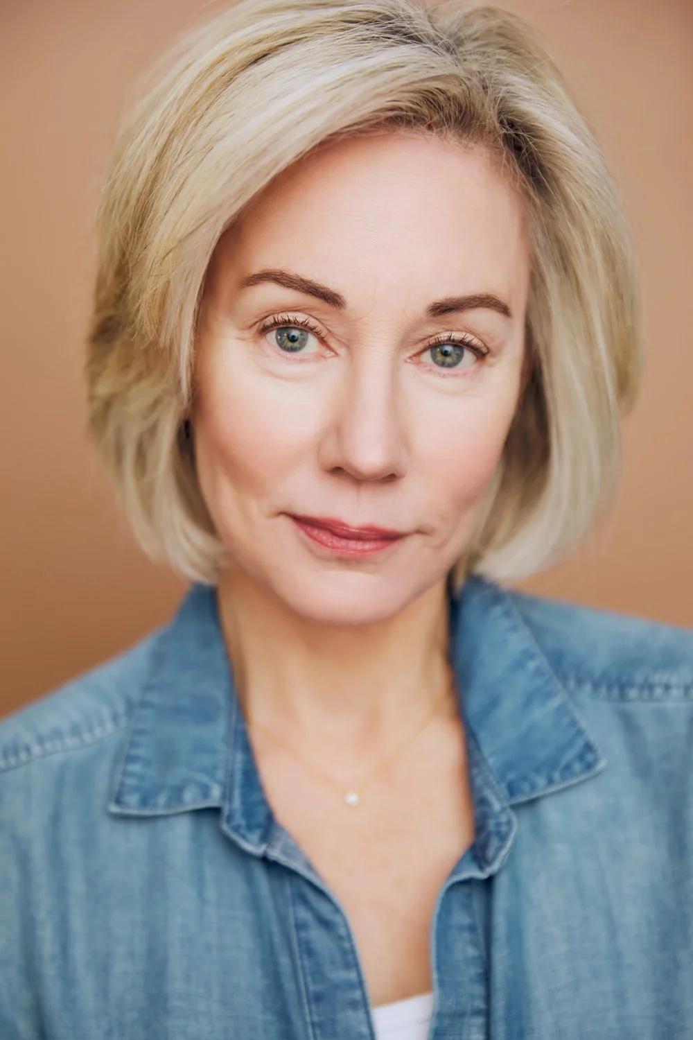 Laura Austin headshot above Gallery button