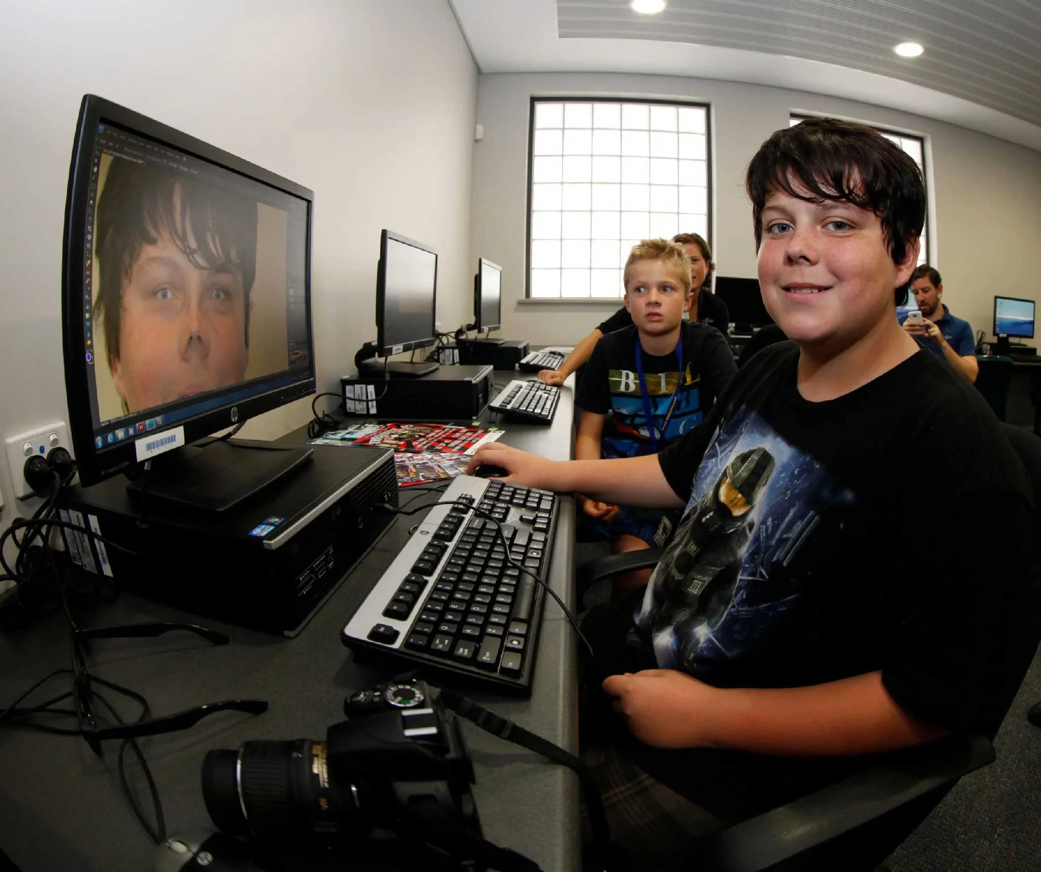 teenagers at Kwinana Youth Service learning graphic design in the creative studio