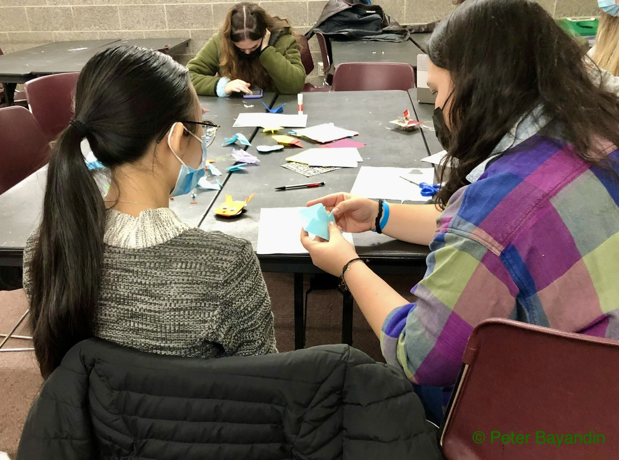 Club President Arijo helps a member with their model, by Peter Bayandin
