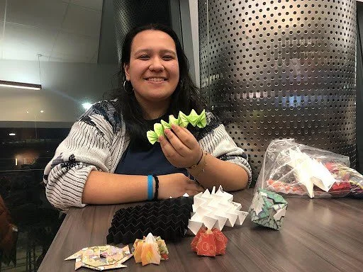 Elizabeth Arjiro holding her most recent creations, by Peter Bayandin