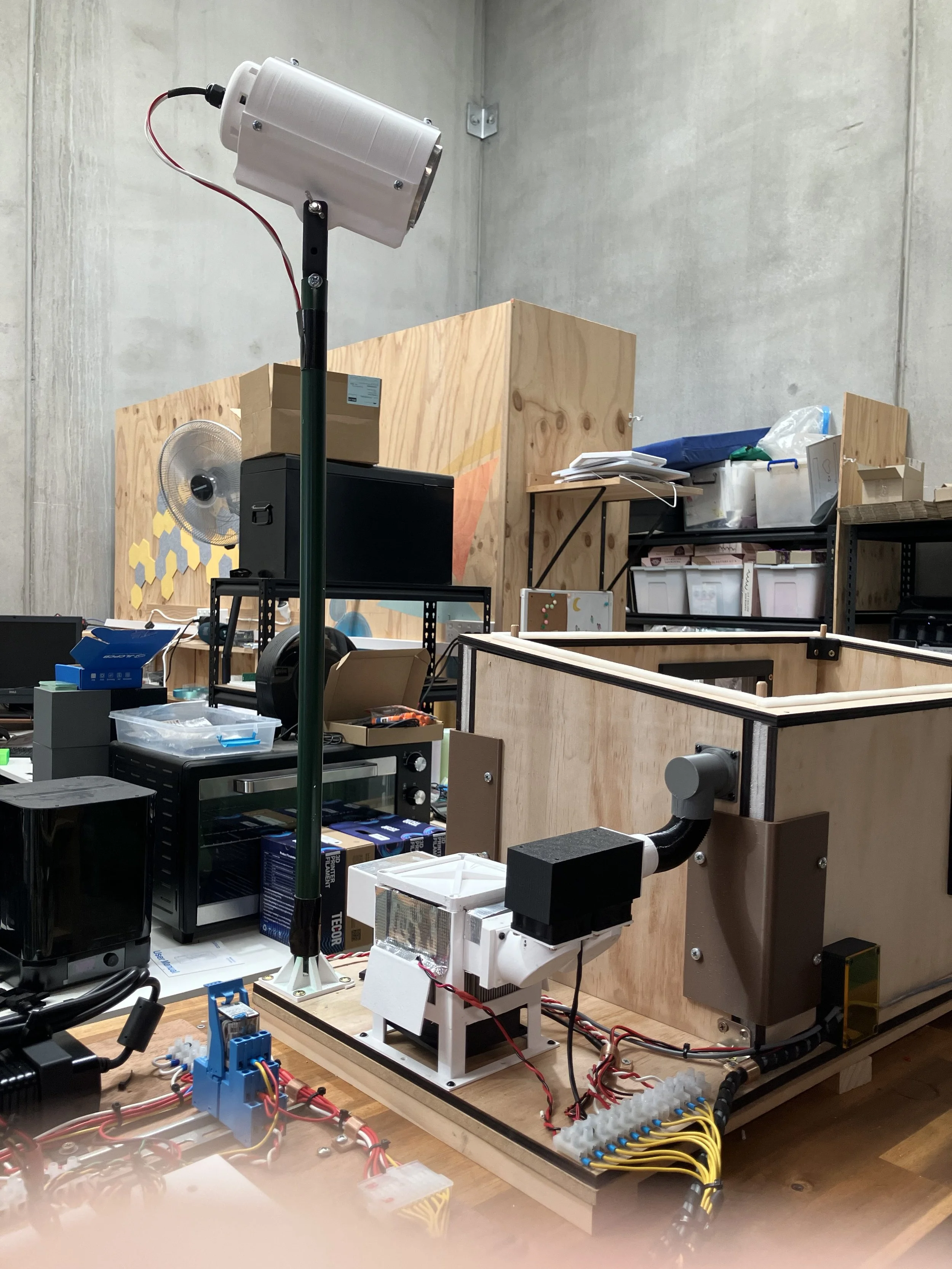 Model house from LHS showing sun on pole above house