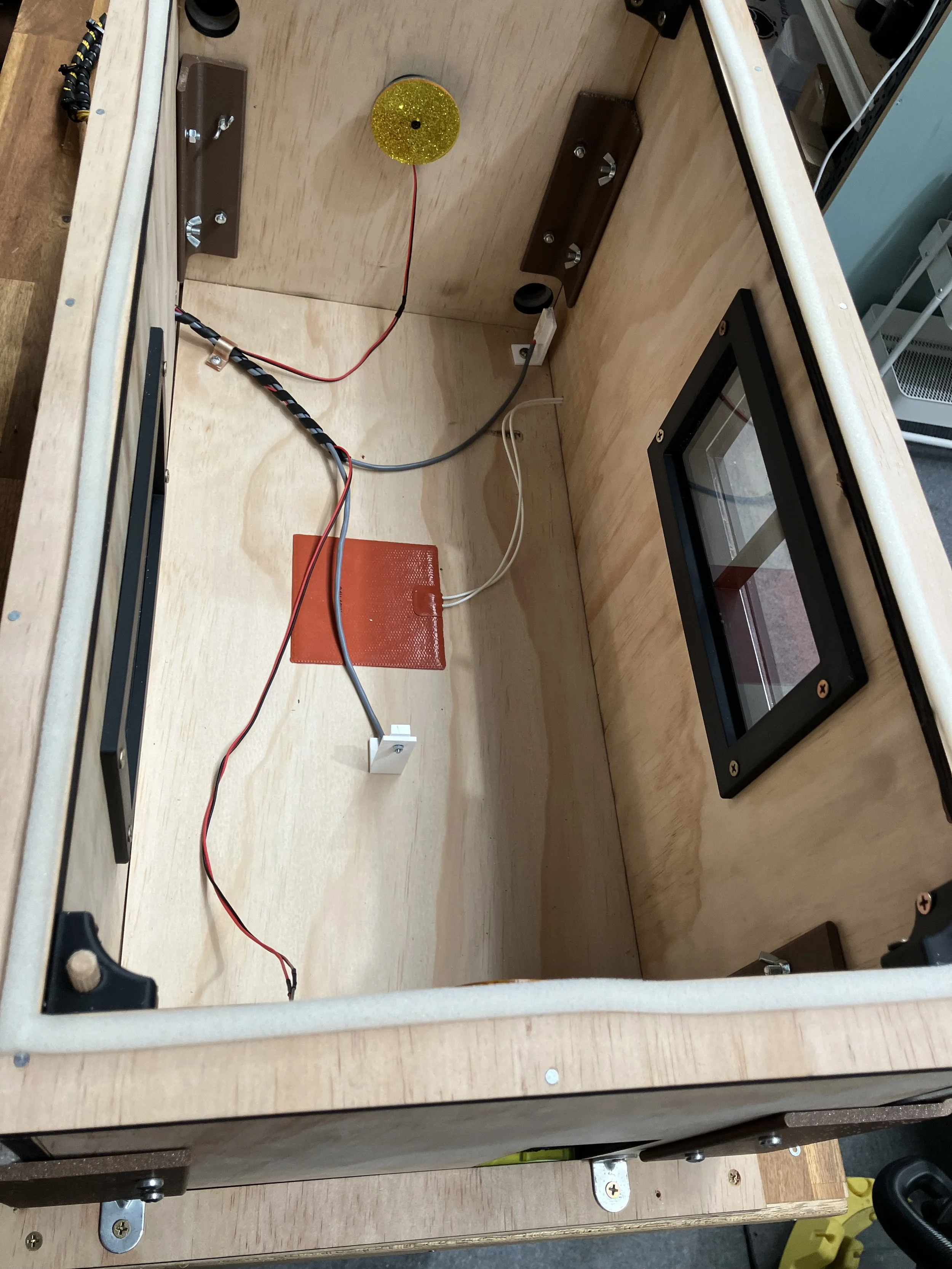 Top view of the model house without roof to show temperature sensors and floor heater and also lights