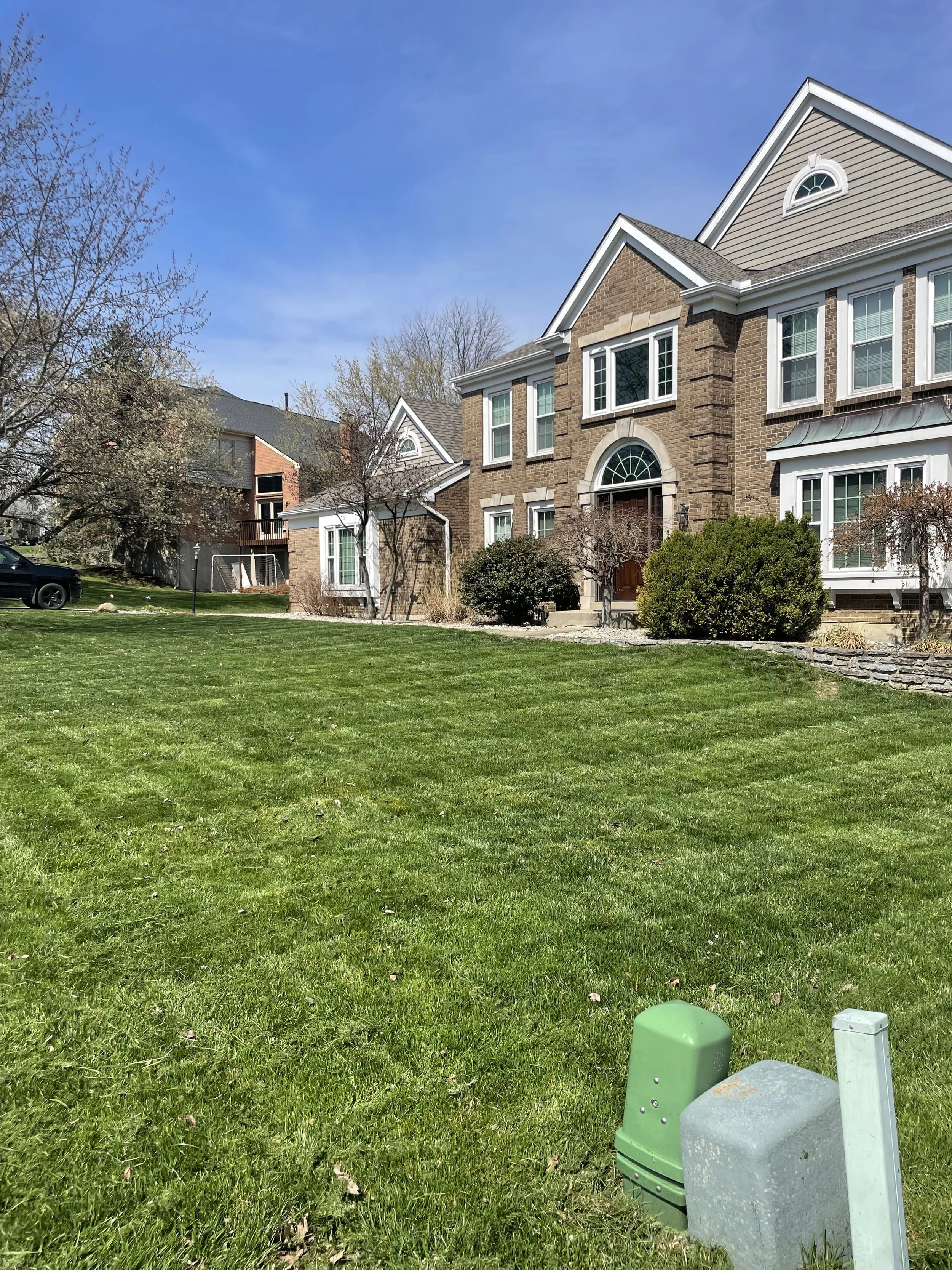 Clean lawn mowing with sharp edging in Northern Kentucky residential yard