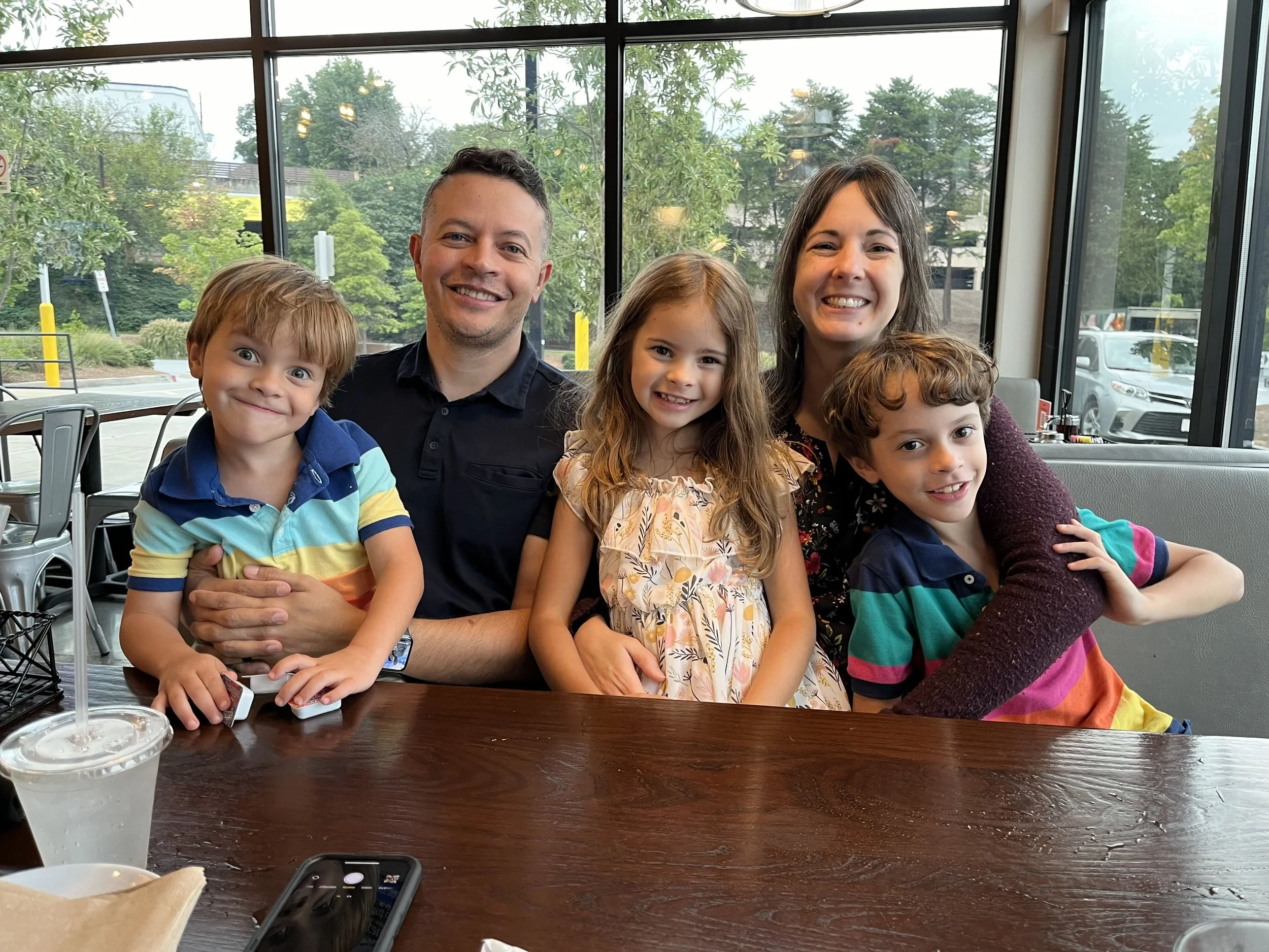 Dr. Moore and her family at a restaurant.