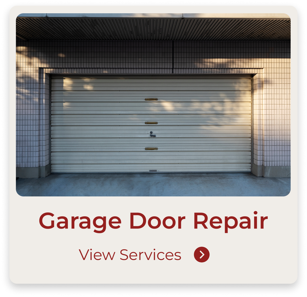 A closed, white garage door with yellow handles and a lock, surrounded by a tiled wall with sunlight and shadow patterns.