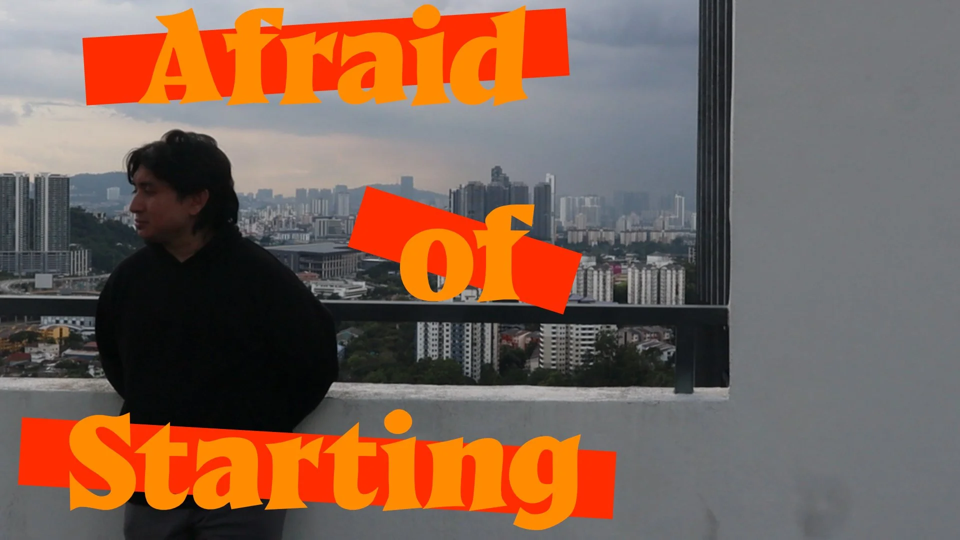 A person standing on a balcony with a city skyline in the background, overcast sky, with the words 'Afraid of Starting' in large orange and yellow text overlaying the image.