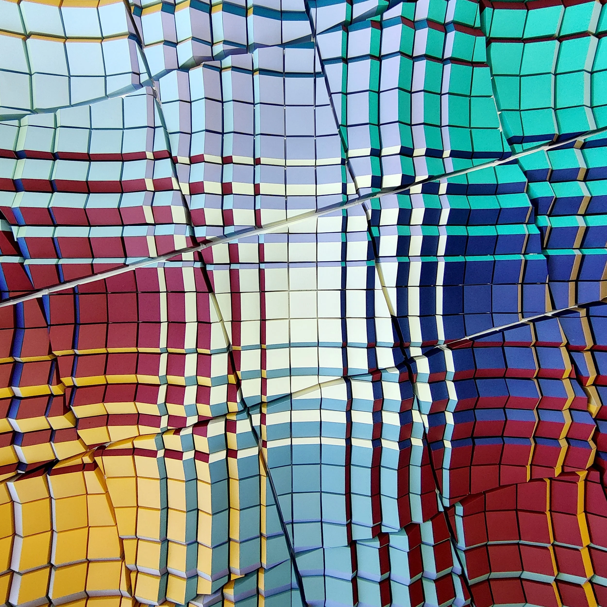 A colorful abstract geometric pattern consisting of 3D cube shapes in various colors including red, yellow, blue, teal, purple, and white, with some sections appearing warped or distorted.