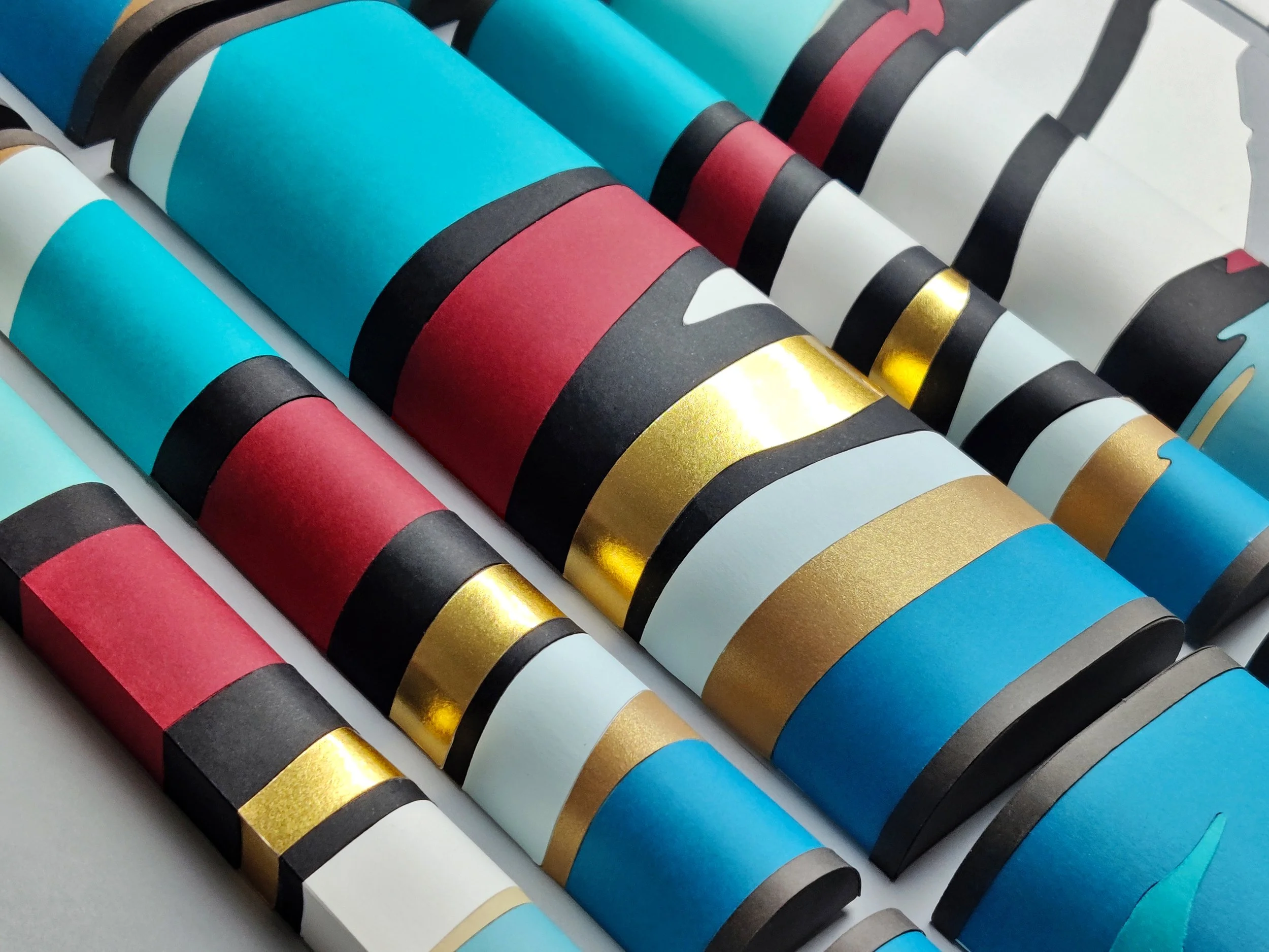 Colorful graduation caps arranged in a pattern.