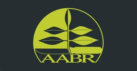 A logo with a green circular background, stylized plant leaves, and the letters 'AABR' at the bottom.