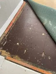 Brown asbestos floor tiles