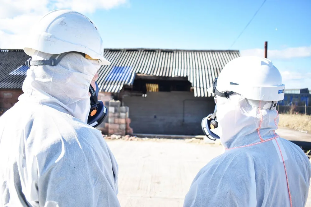 Asbestos removal operatives wearing respiratory protective equipment during asbestos works