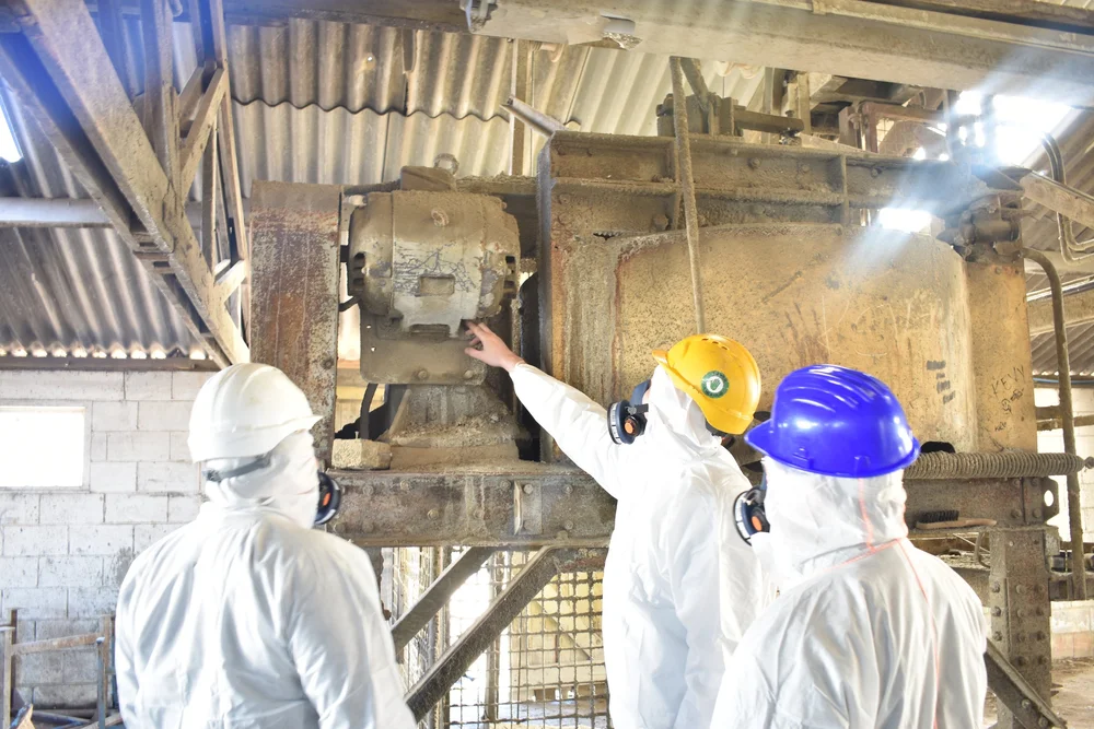 ASM asbestos surveyors re-inspecting previously identified asbestos materials around industrial plant