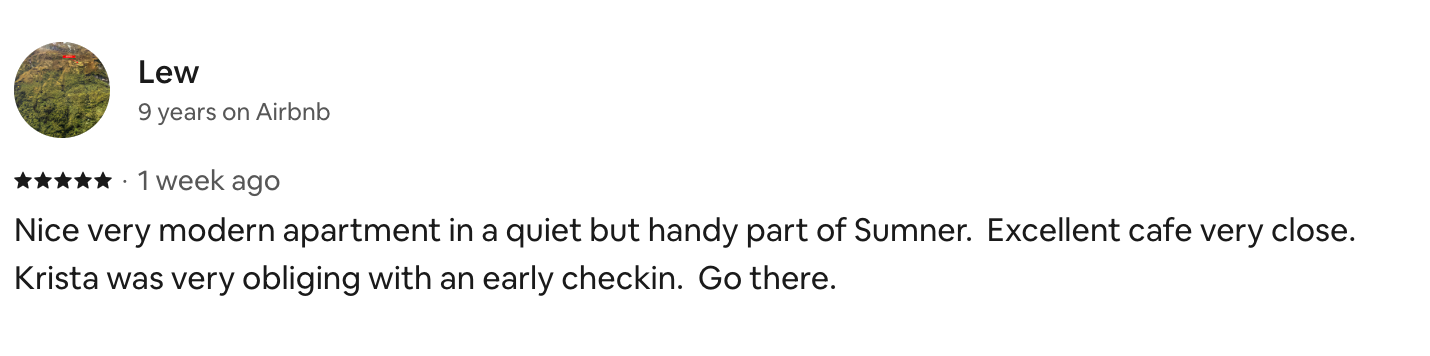 Screenshot of an Airbnb review for a modern apartment in Sumner, expressing satisfaction with the location, the cafe nearby, and the check-in process.