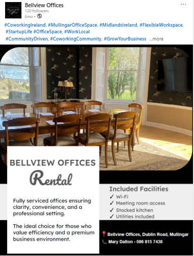 Interior view of a meeting room with a wooden table and eight chairs, large windows with blinds showing trees outside, and a wall-mounted TV, with a digital overlay advertising rental office space at Bellview Offices in Dublin Road, Mullingar.