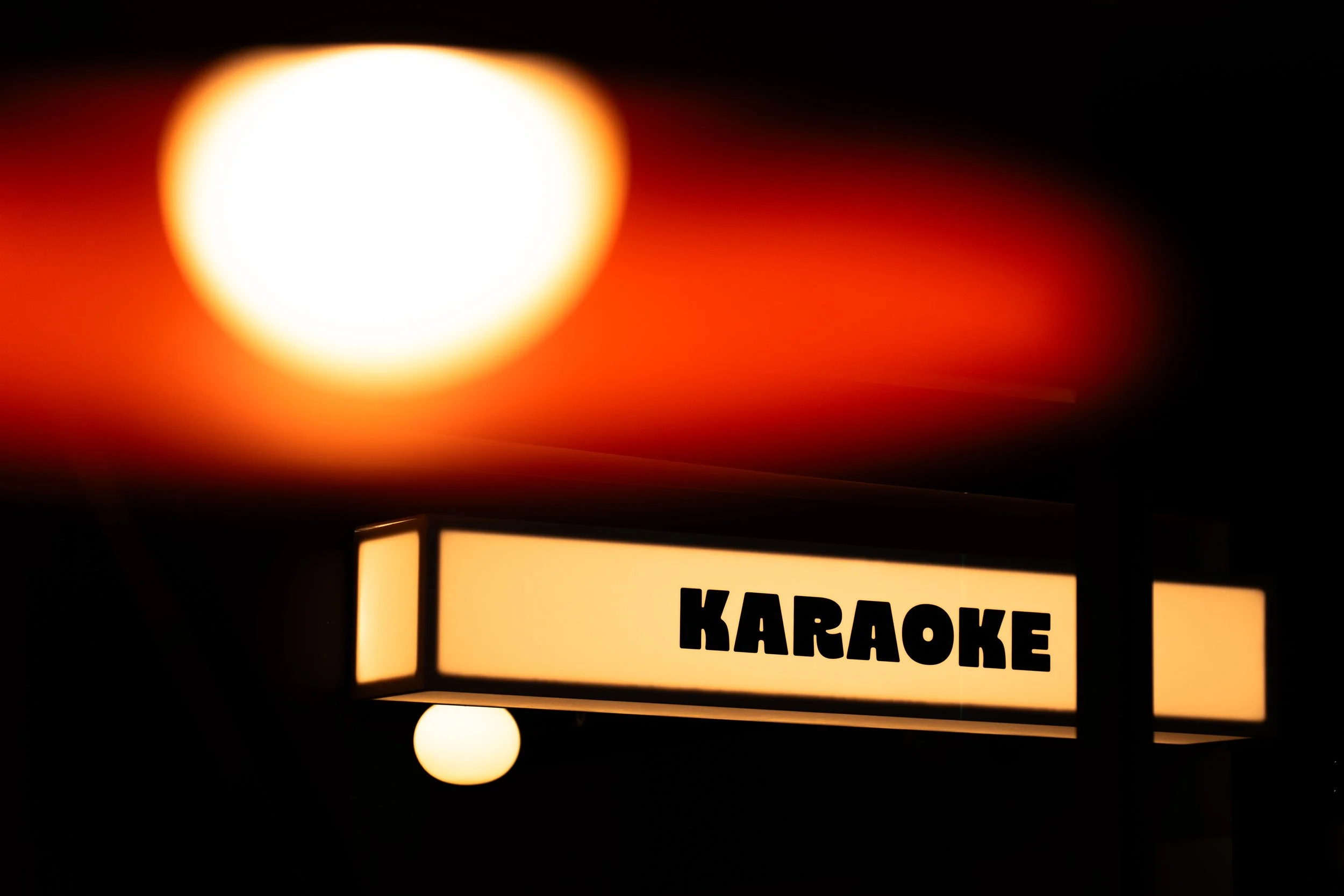 Karaoke Sign in the venue which is a bright LED white box 