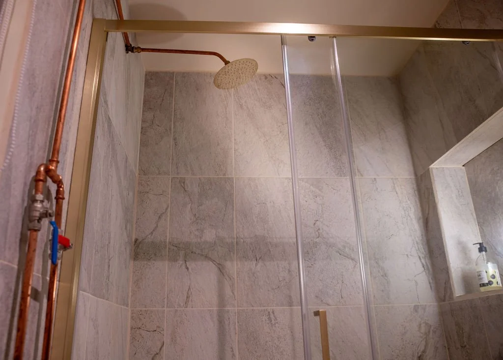 large walk-in hot indoor shower at Beck off-grid cabin