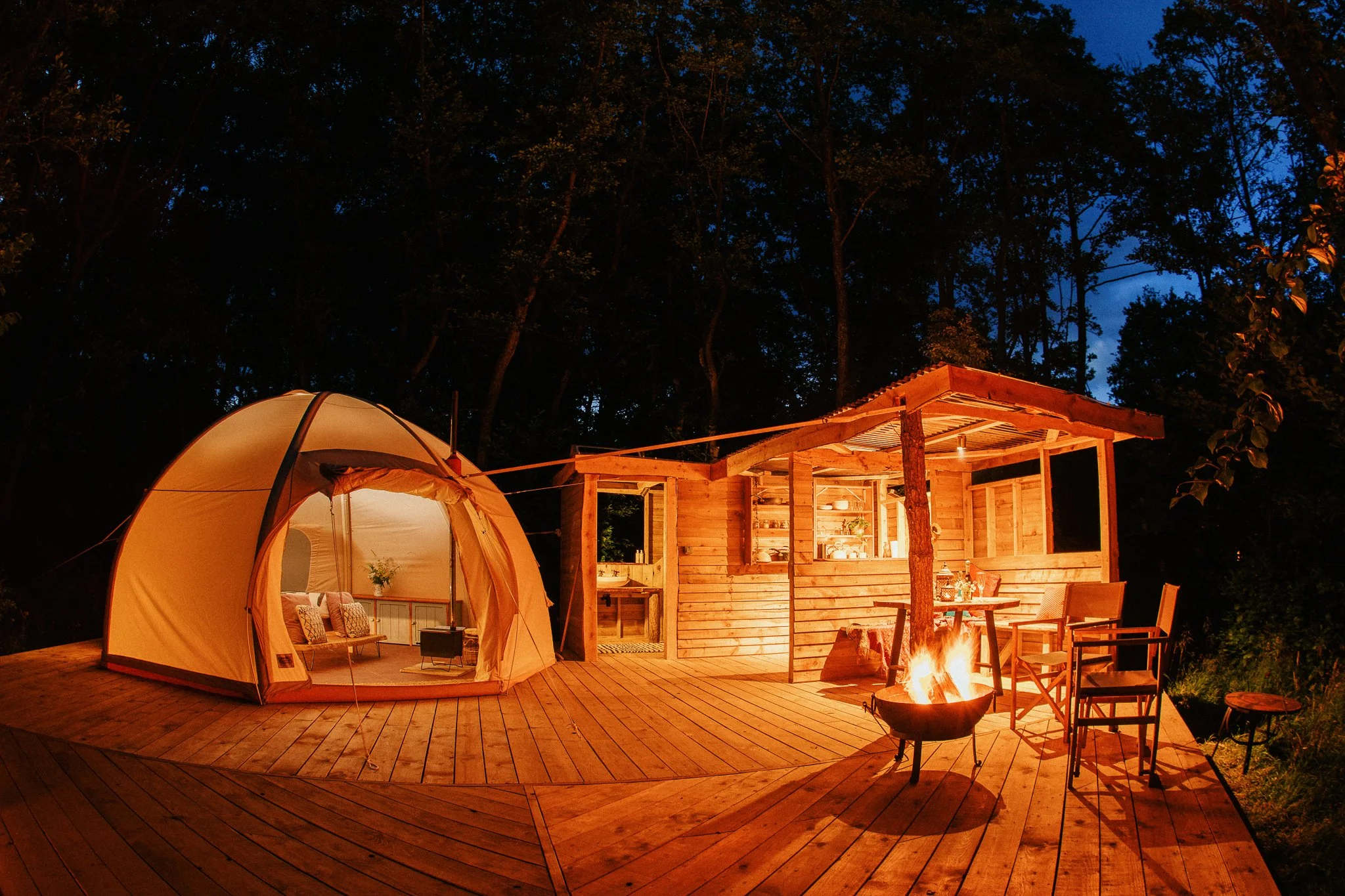 Gorgeous glamping site illuminated at night 