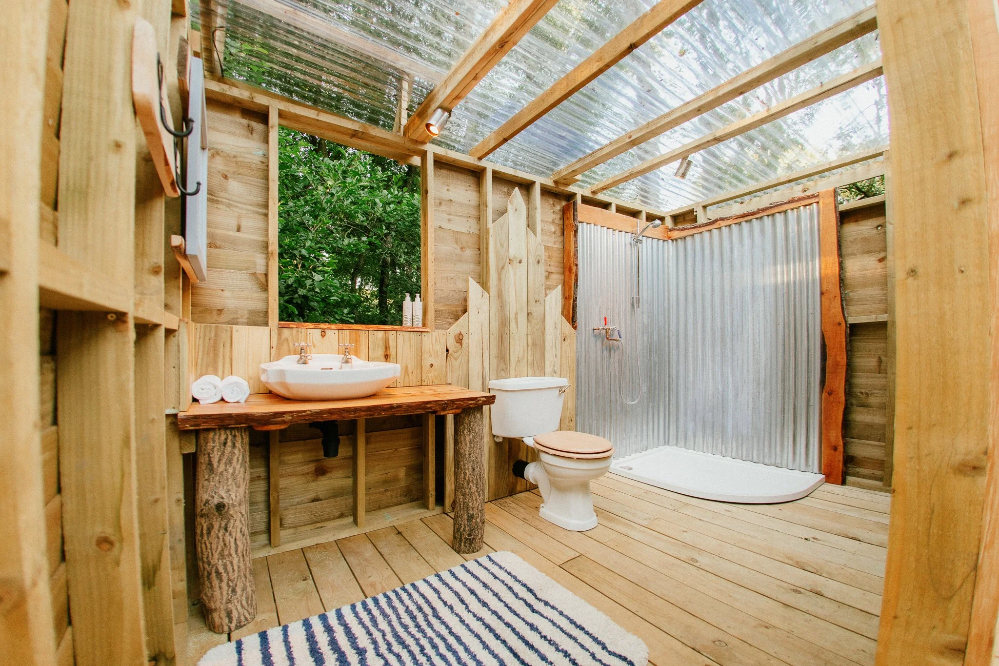 Creekside bathroom, Showing, flushing toilet and walk in shower 