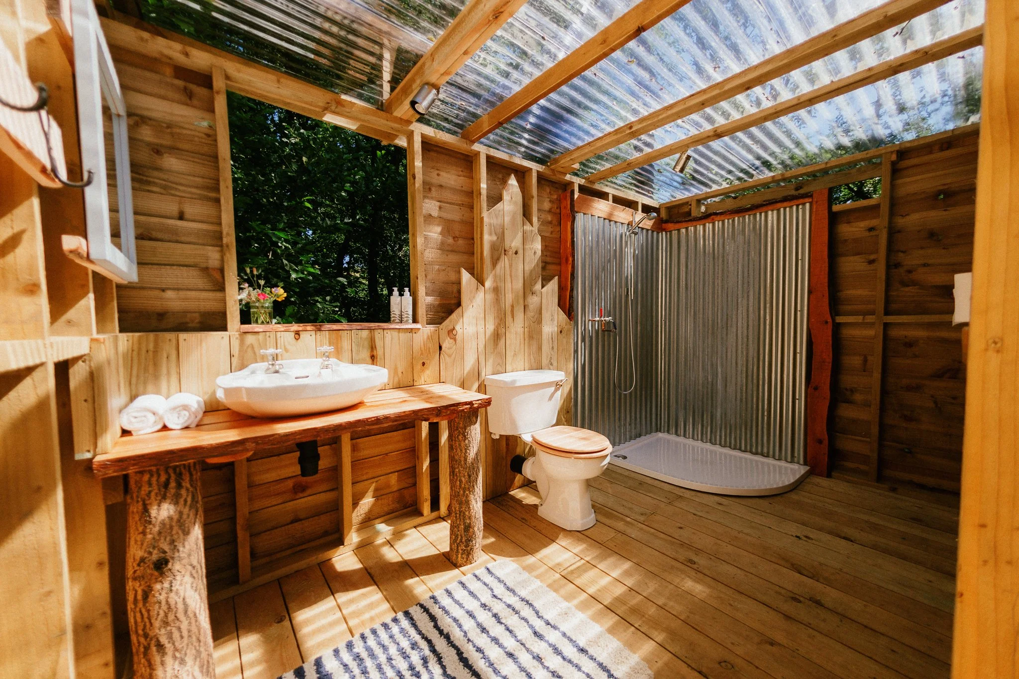 Spacious bathroom wooden private bathroom in glamping site 