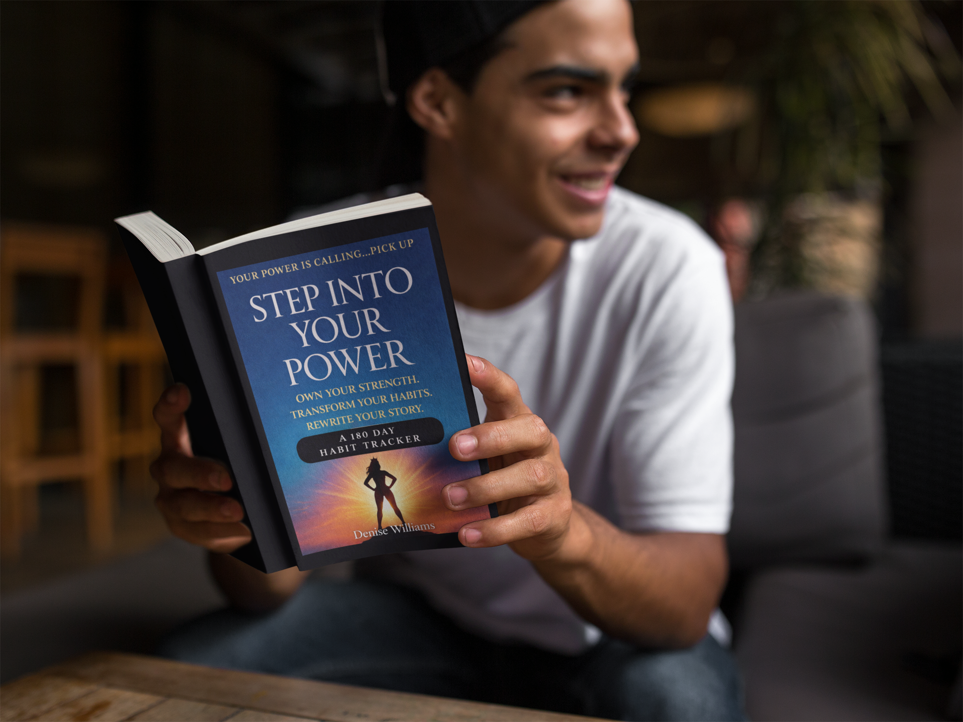 young-man-reading-his-paperback-book-mockup-a12025.png