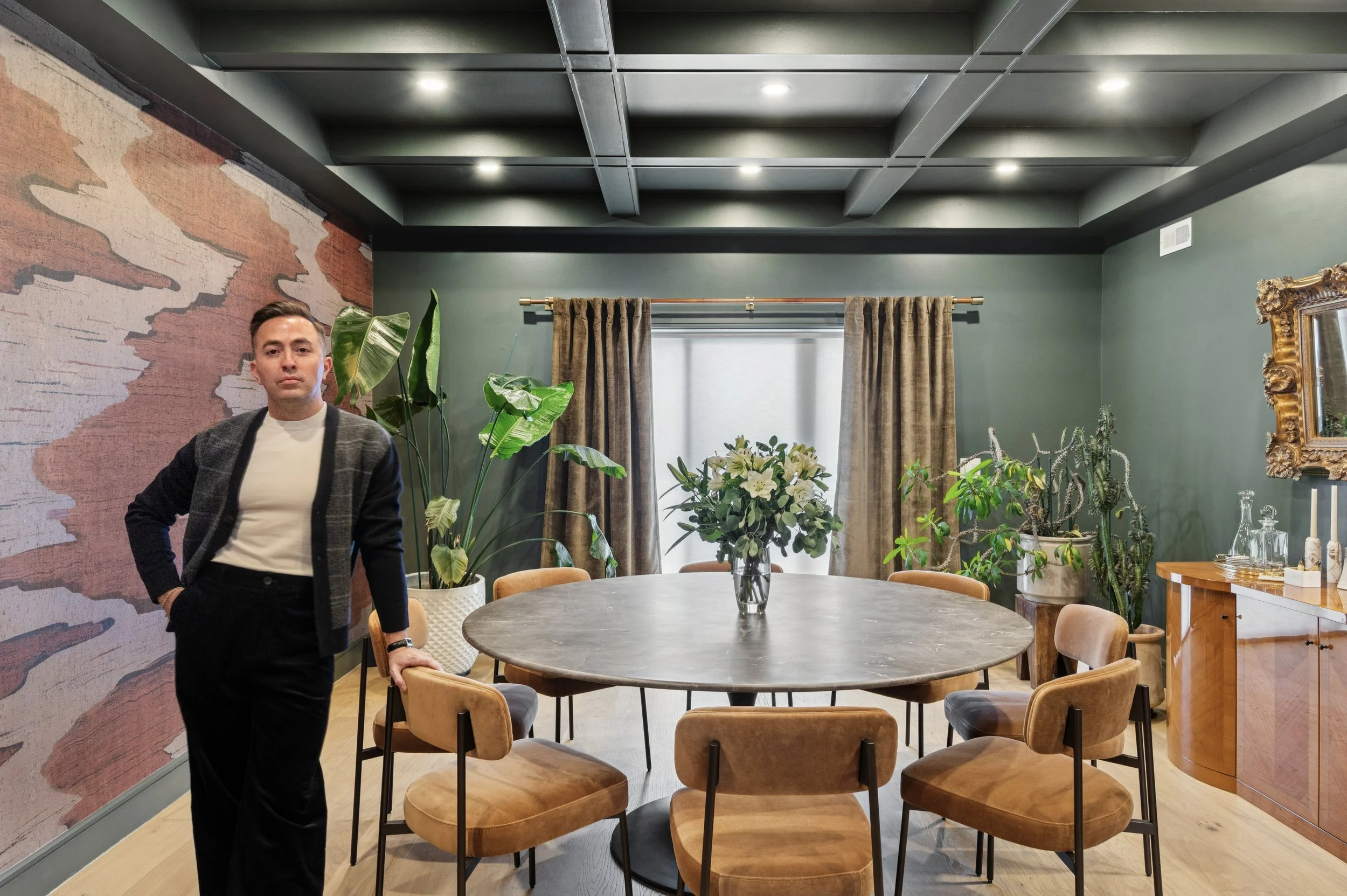 Arthur Loya, luxury interior designer, photographed in a refined residential living room he designed.